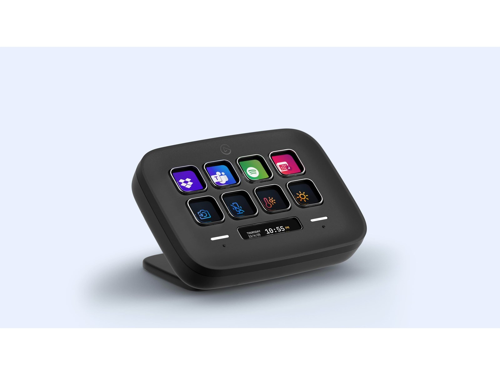 Panel de control negro con iconos iluminados. Presenta iconos para aplicaciones como Spotify, Teams y calendario. Muestra la hora y la fecha. Se apoya en una base.