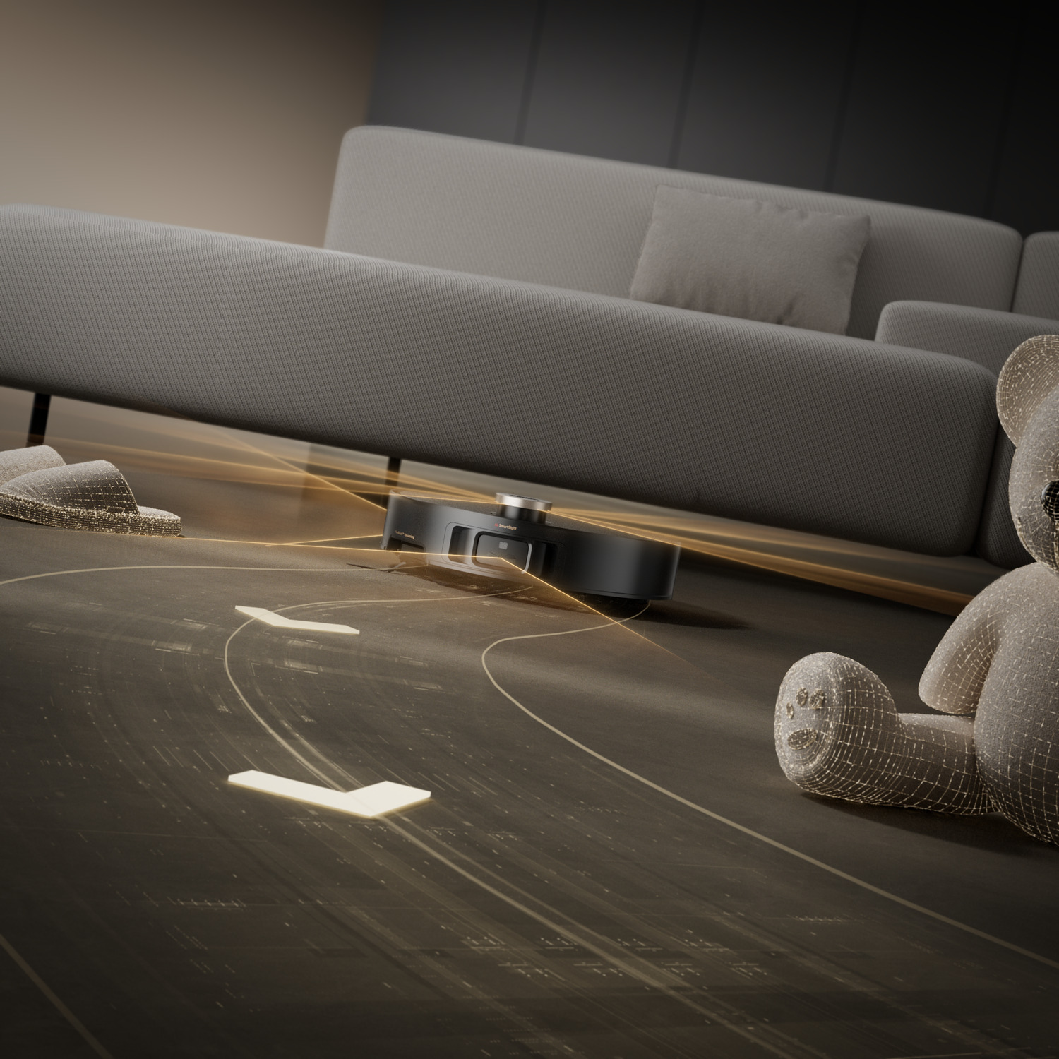 Un aspirateur robot nettoie un sol en bois. Un ours en peluche, des pantoufles et un canapé sont en arrière-plan.