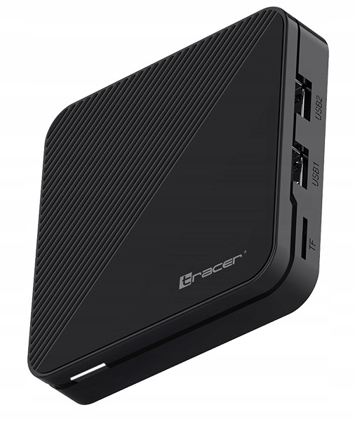 Czarne urządzenie Tracer z teksturowaną powierzchnią. Widoczne porty USB i gniazdo TF. Urządzenie jest pochylone, na białym tle.