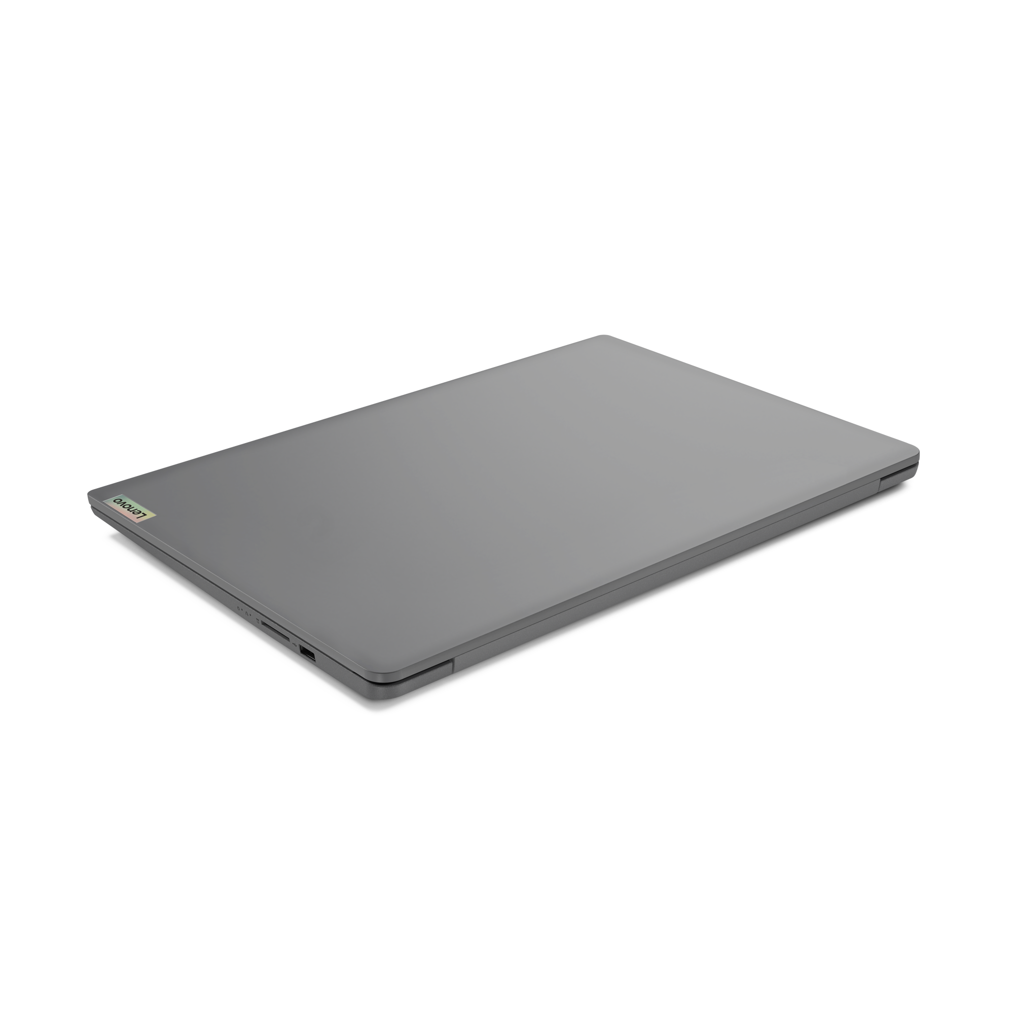 Ein geschlossener grauer Lenovo-Laptop auf schwarzem Hintergrund. Der Laptop ist abgewinkelt.