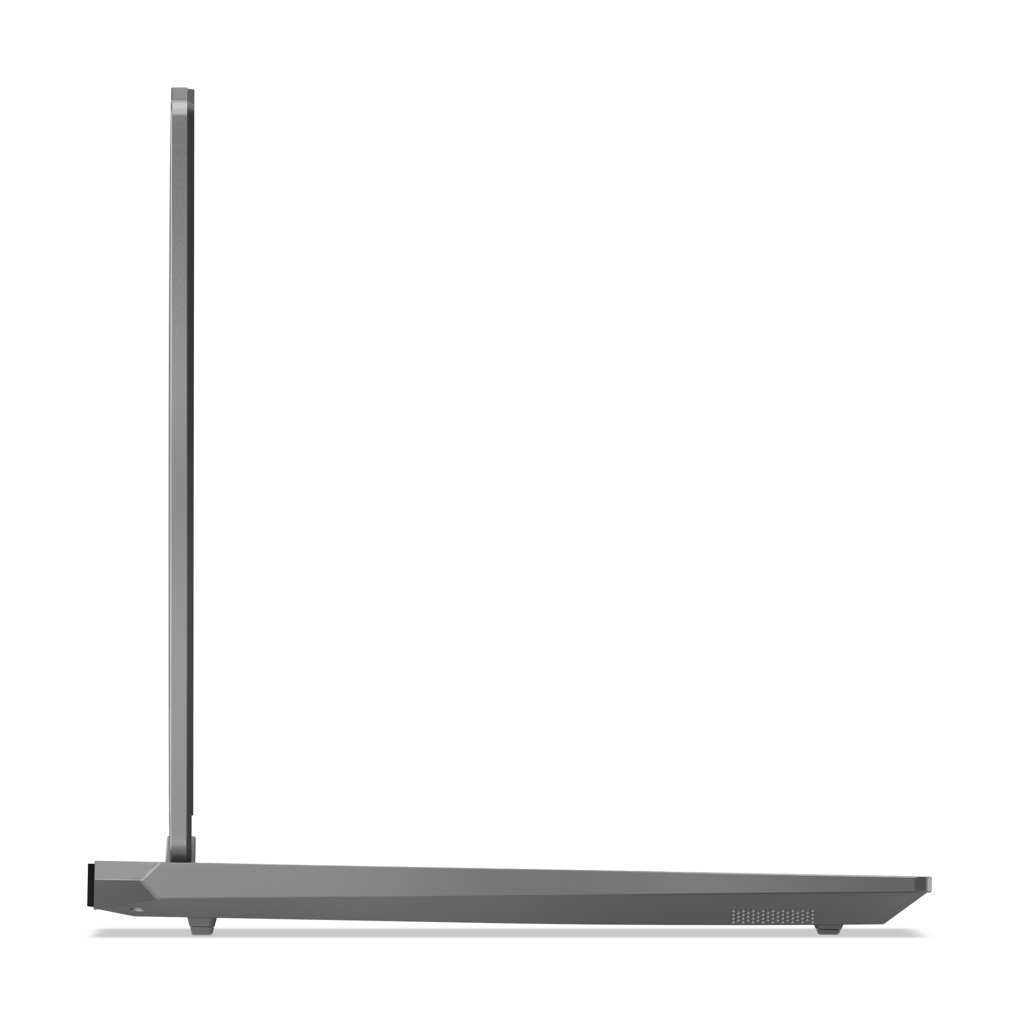 Seitenansicht eines grauen Laptops. Der Bildschirm ist geschlossen. Schwarzer Hintergrund, weißer Raum. Der Laptop steht auf einer flachen Oberfläche.