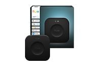 Deux hubs intelligents Hue Bridge Pro noirs. Un devant, un derrière. La boîte montre la compatibilité avec Alexa, Apple Home et Google Home.