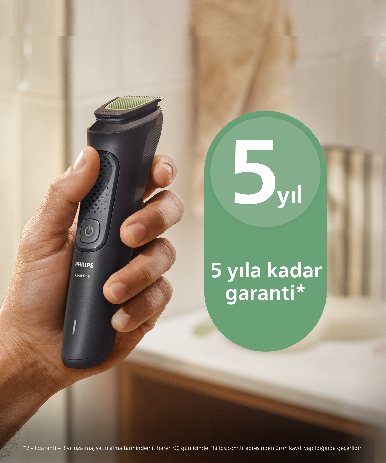 Bir el siyah Philips tıraş makinesi tutuyor. Yeşil bir dairede '5 yıl' yazıyor. Altındaki metin '5 yıla kadar garanti' diyor.