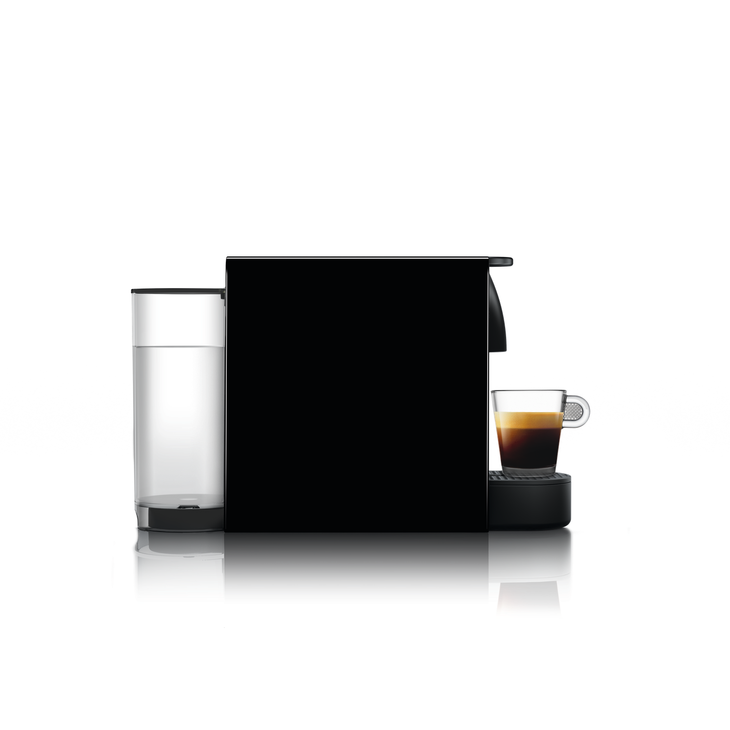 A black coffee machine with a clear glass cup of espresso. A water container is on the left.