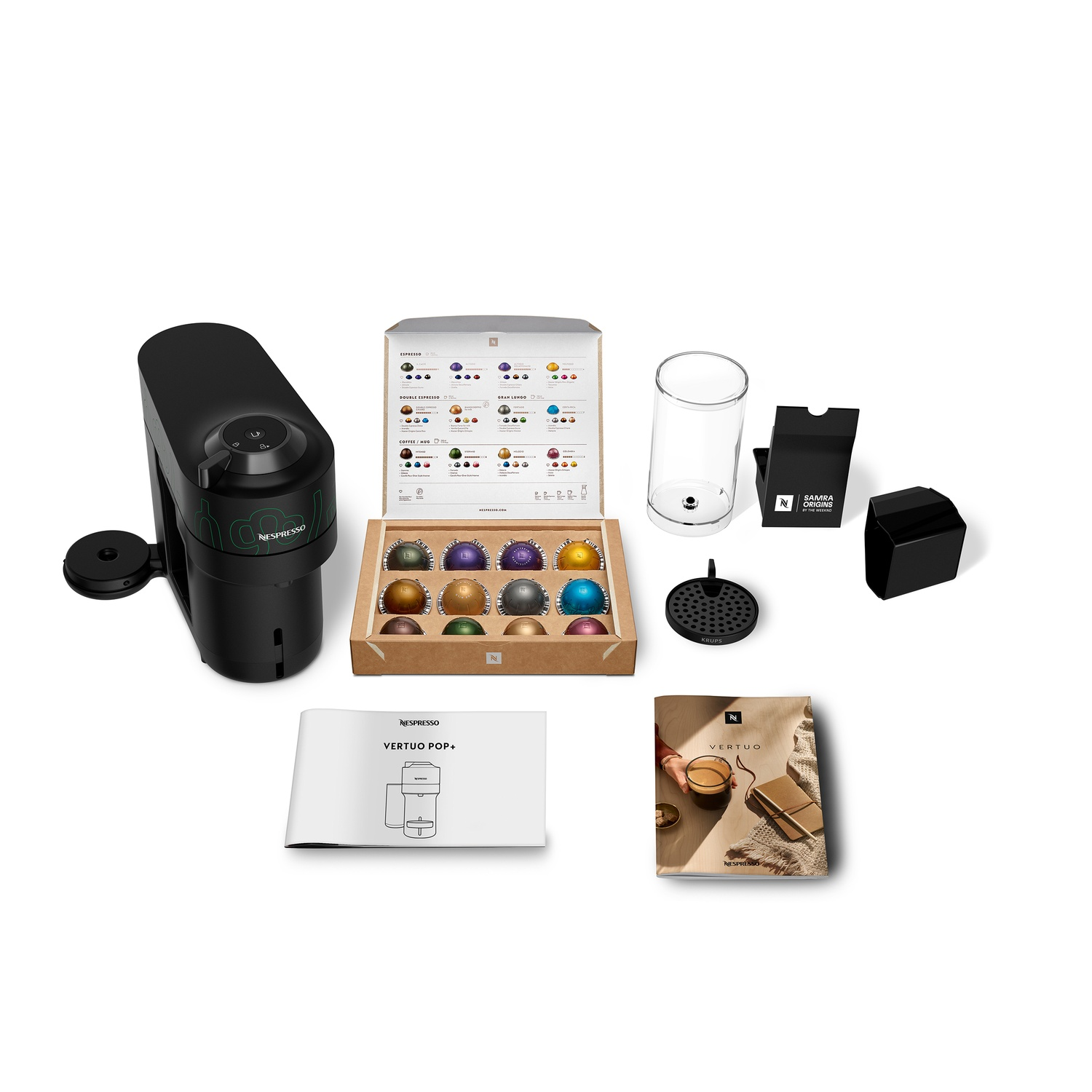 A Nespresso Vertuo Pop+ machine with coffee pods, glass, filter, and accessories on a white surface.