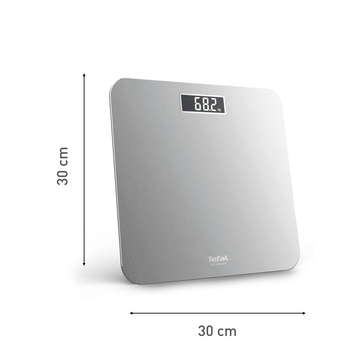 A silver digital bathroom scale displays 68.2 kg. The scale is 30x30 cm and has the Tefal PREMISS logo.