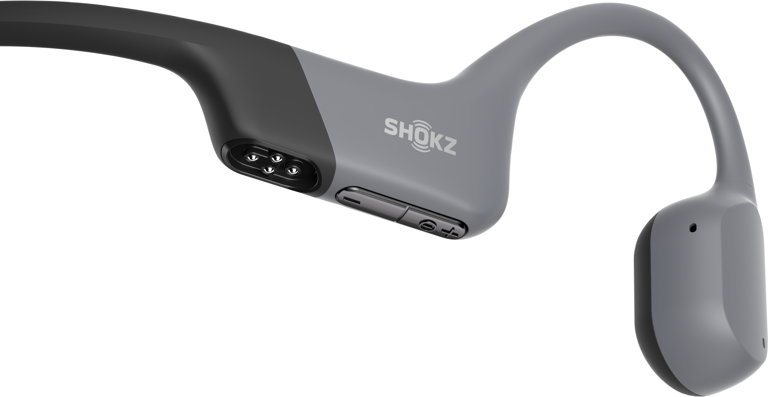 Grau-schwarzer Shokz-Knochenschallkopfhörer. Das Shokz-Logo ist sichtbar. Die Ohrhörer sind abgerundet und haben Steuertasten. Schwarzer Hintergrund.
