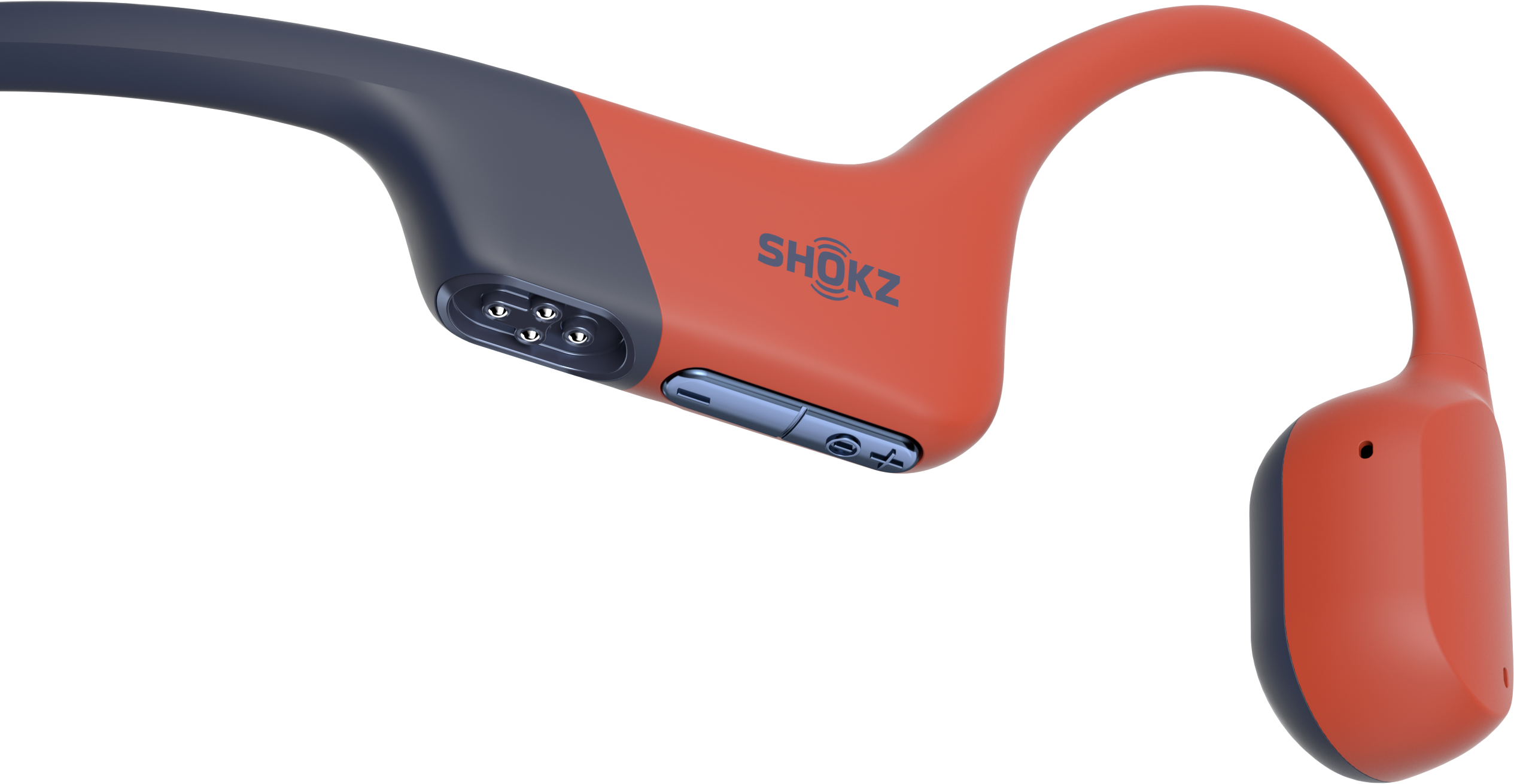 Ein orangefarbener und blauer Shokz-Knochenschallkopfhörer. Das Gerät hat eine Hakenform für die Platzierung im Ohr und Lautstärkeregler.