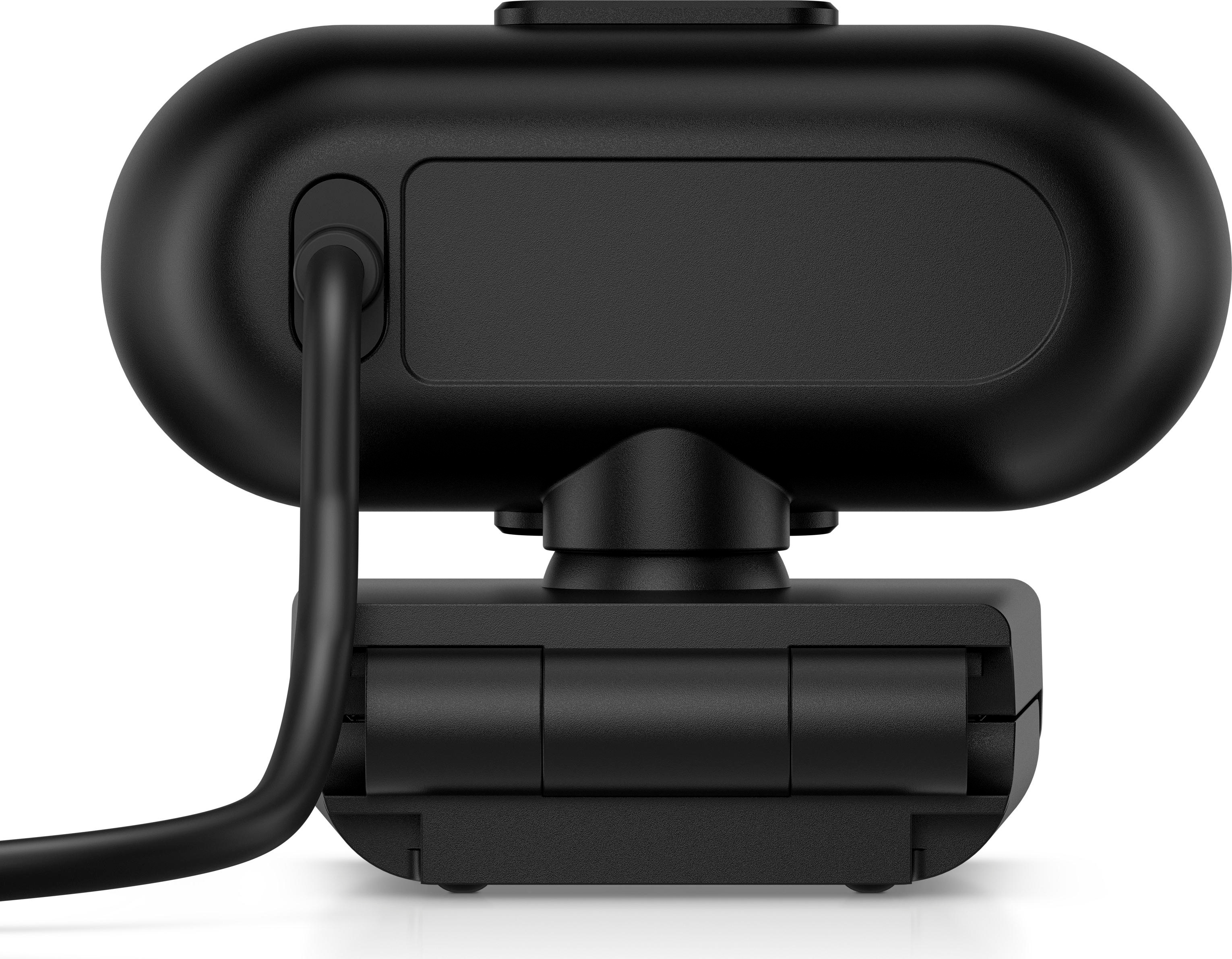 Schwarze Webcam mit abgerundeter Oberseite und rechteckiger Basis. Ein dickes Kabel erstreckt sich von oben. Der Hintergrund ist weiß.