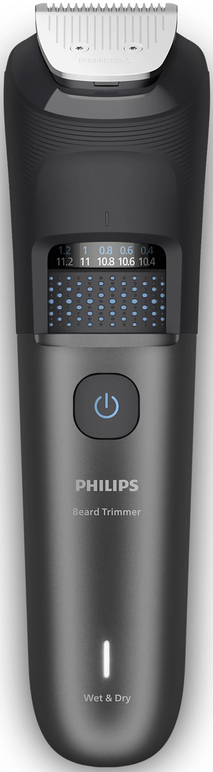 Un regolabarba Philips nero. Ha un pulsante di accensione, un display con impostazioni di lunghezza ed è etichettato Wet & Dry.