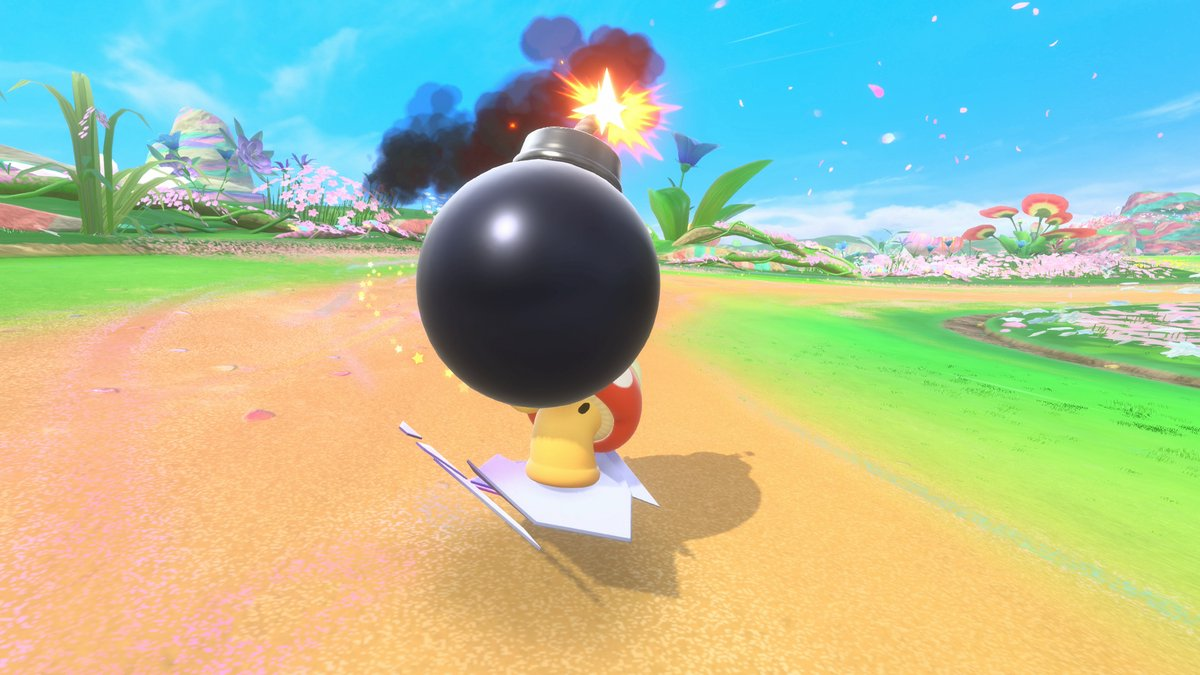 A black bomb with a lit fuse is held by a mushroom character on a paper airplane, in a colorful, flowery environment.