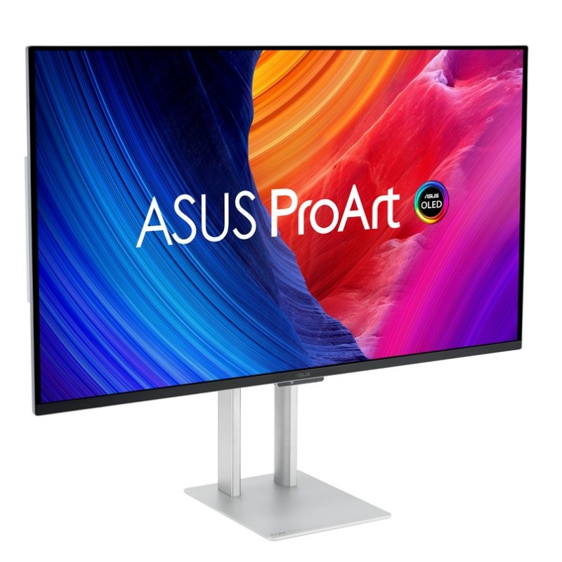 Un monitor ASUS ProArt OLED sobre un soporte plateado. La pantalla muestra un diseño abstracto colorido. Los logotipos de ASUS y OLED son visibles.