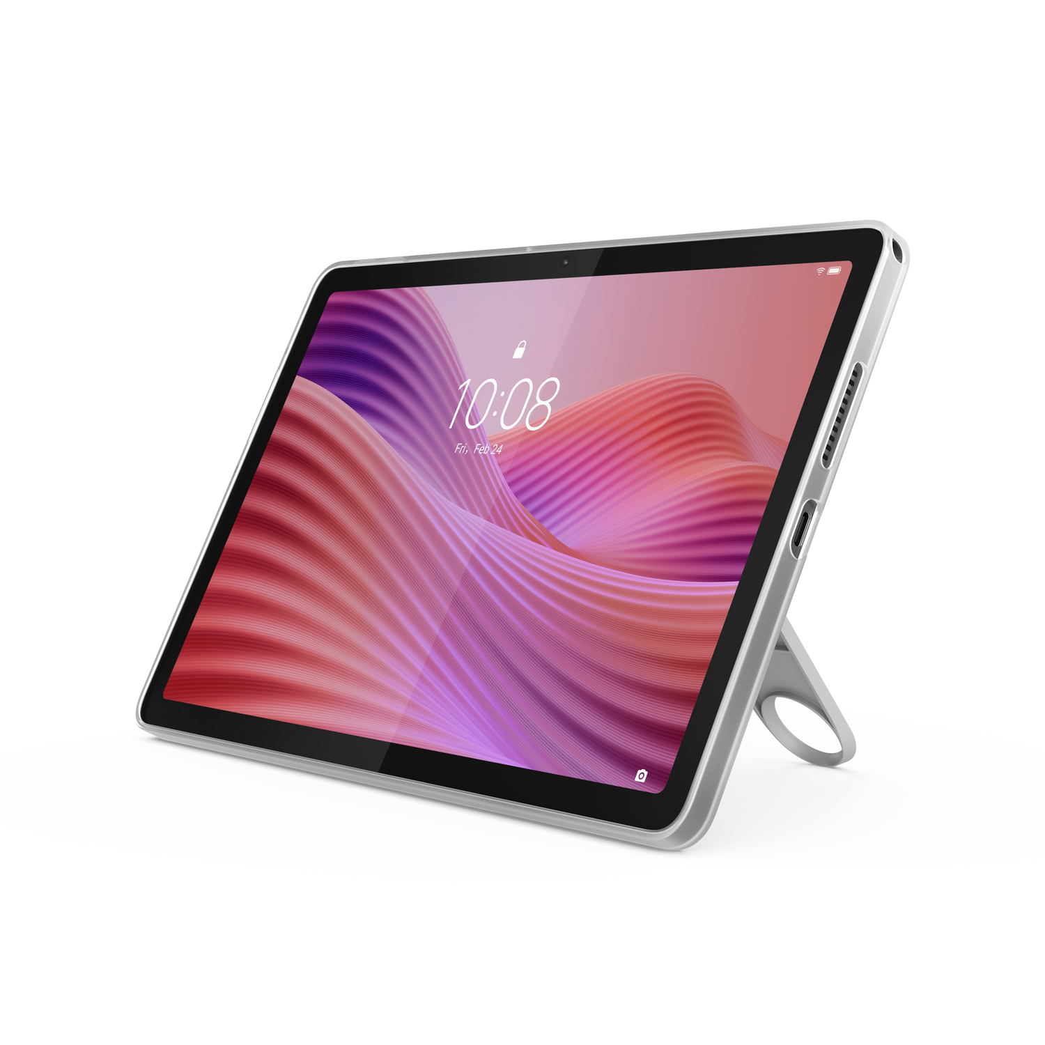 A silver tablet on a white surface. The screen displays a wavy, pink and purple background. The tablet is propped up by a stand.