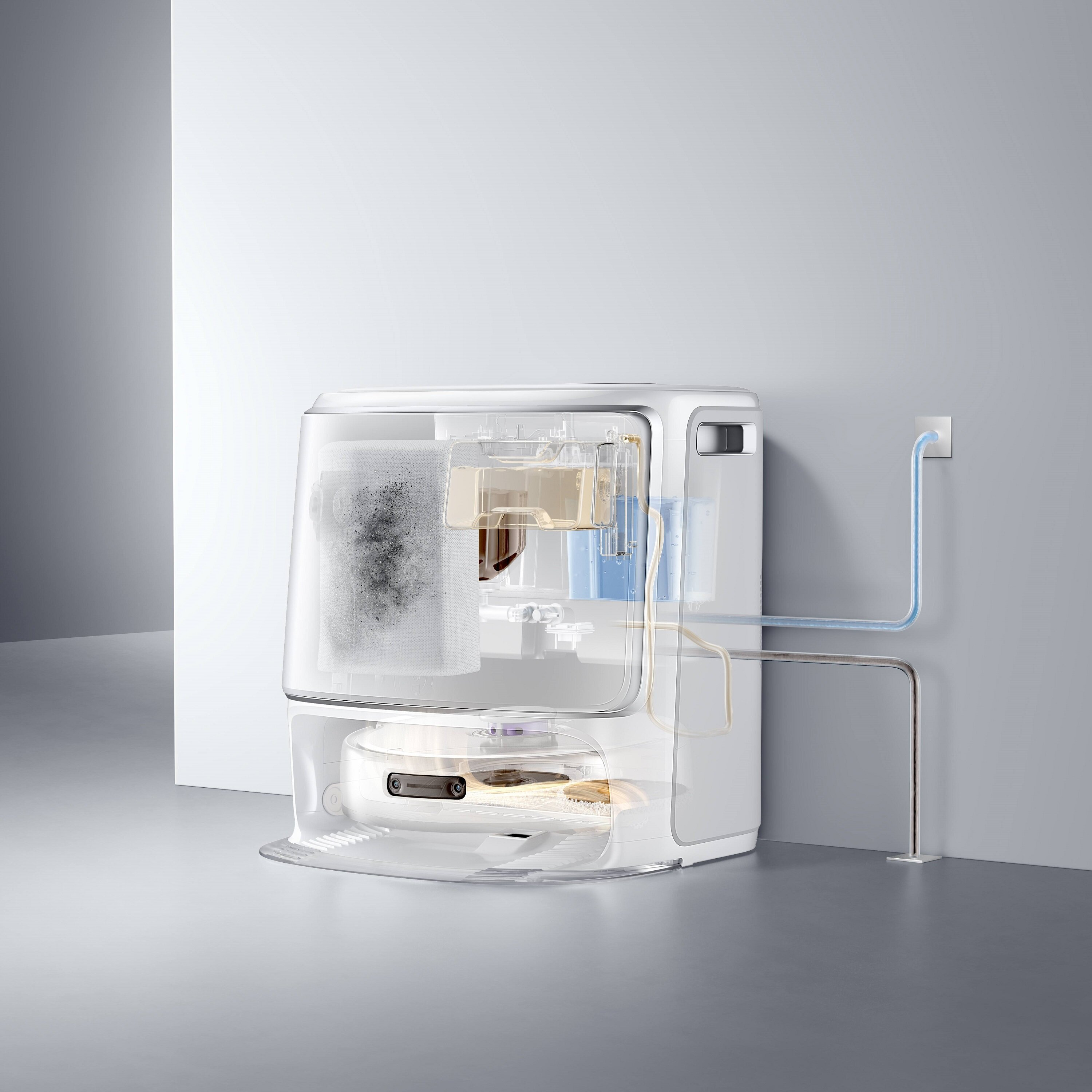 Przezroczysty przekrój białego robota odkurzającego. Pokazuje elementy wewnętrzne, rury wodne i gniazdo ścienne.