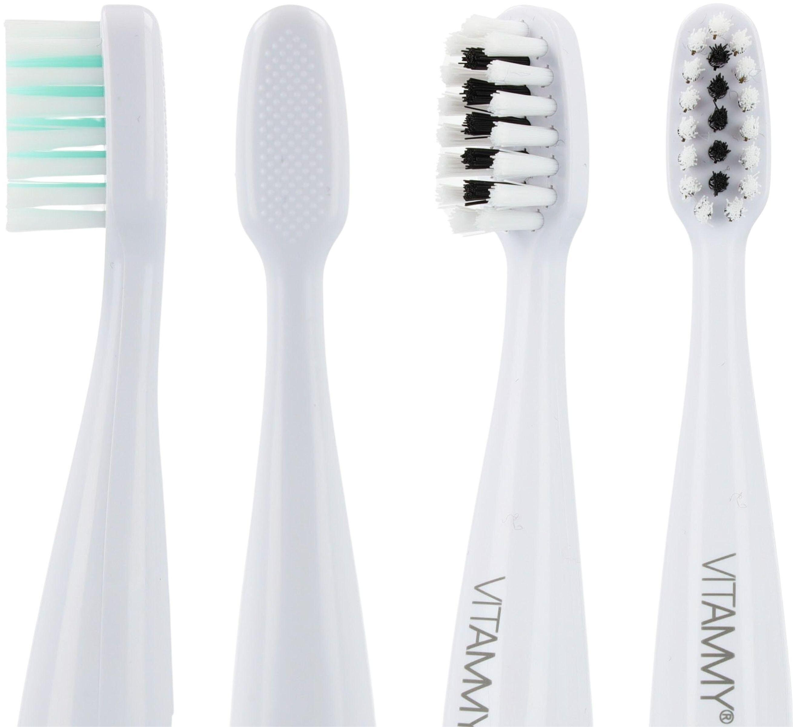 Cztery głowice szczoteczek do zębów w rzędzie. Są białe, z różnymi wzorami włosia, niektóre z czarnym włosiem, inne z zielonym.