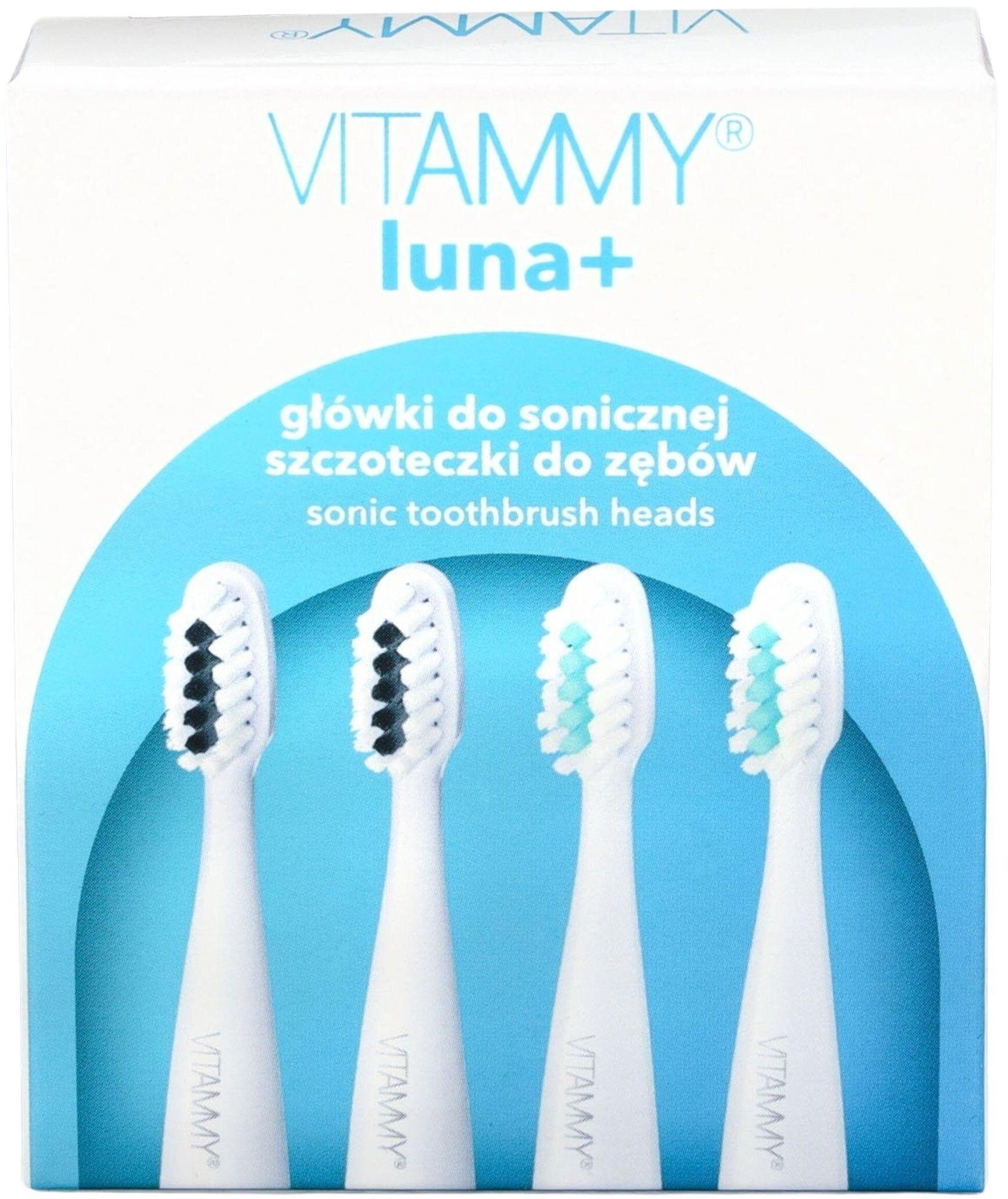 Pudełko z czterema białymi główkami do szczoteczki. Dwie mają czarne włosie, dwie turkusowe. Tekst zawiera 'VITAMMY luna+'.