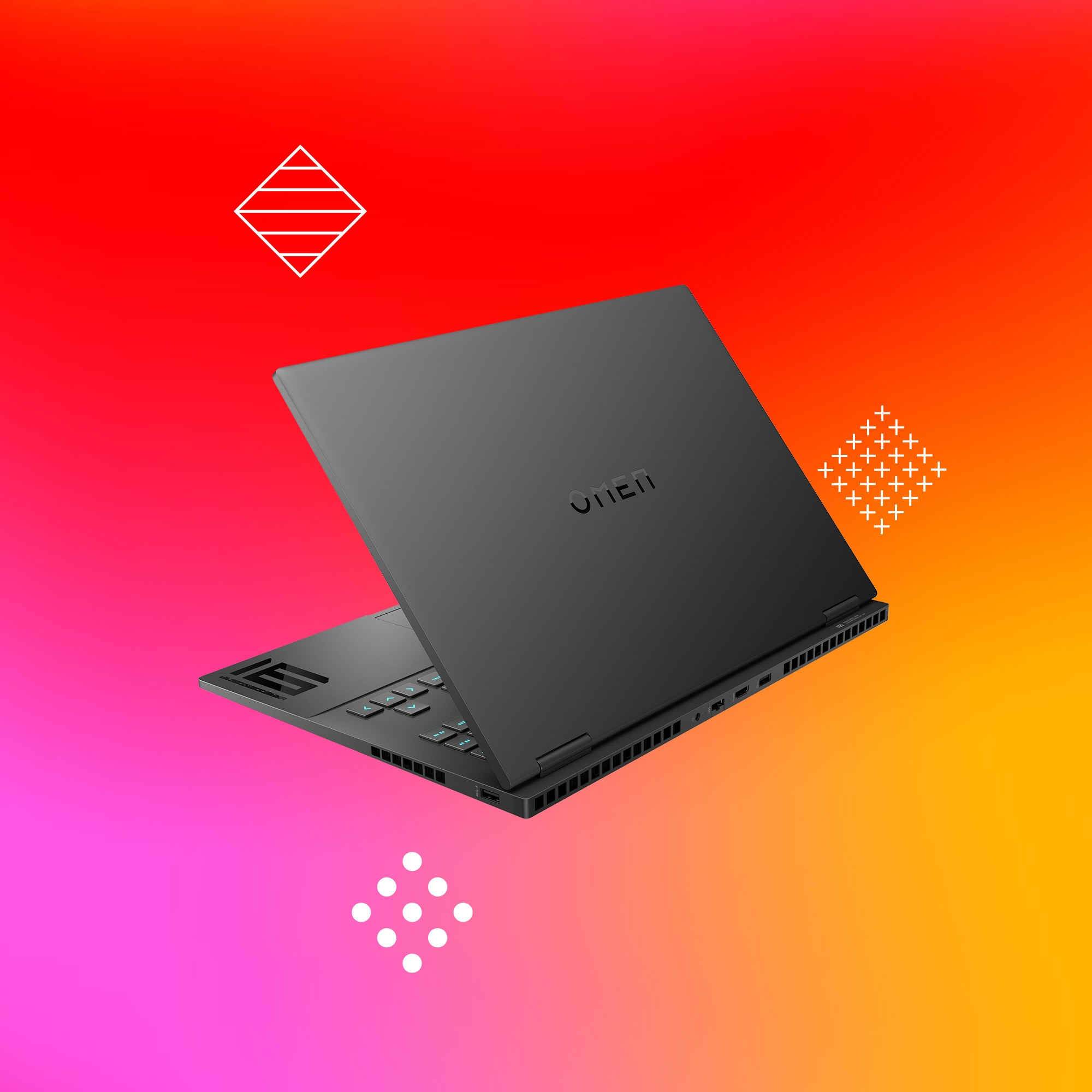 Czarny laptop OMEN otwarty na gradientowym tle. Widoczna klawiatura. Białe geometryczne kształty w tle.