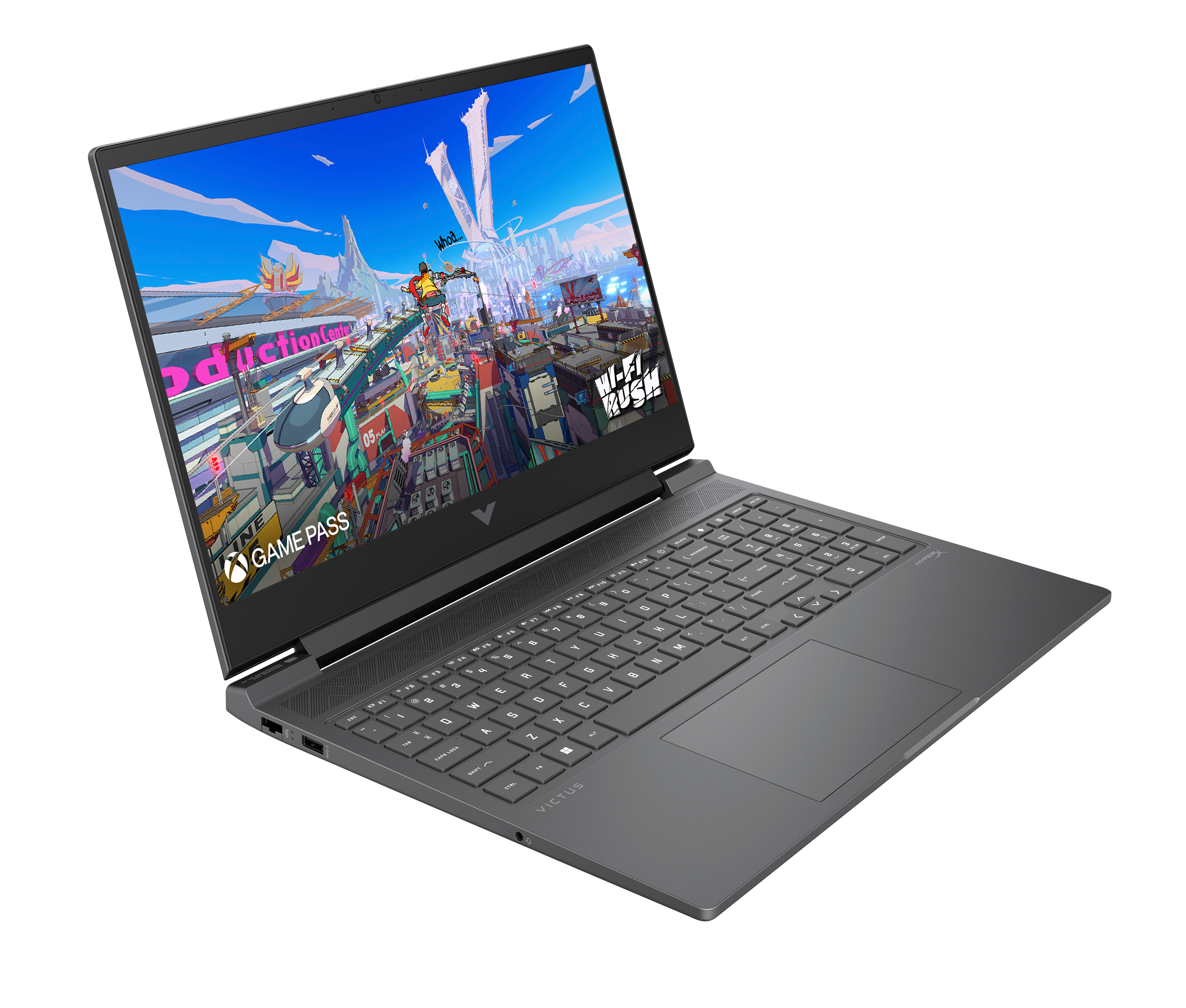 Szary laptop wyświetla scenę z gry. Ekran pokazuje kolorowe budynki i postacie. Klawiatura jest widoczna.