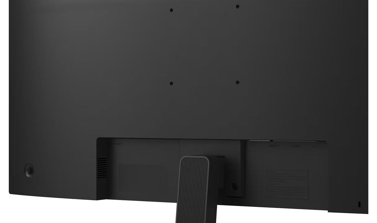 Tył czarnego monitora komputerowego. Widoczne porty: HDMI, USB-C i zasilanie. Cztery otwory na śruby na górnym panelu.