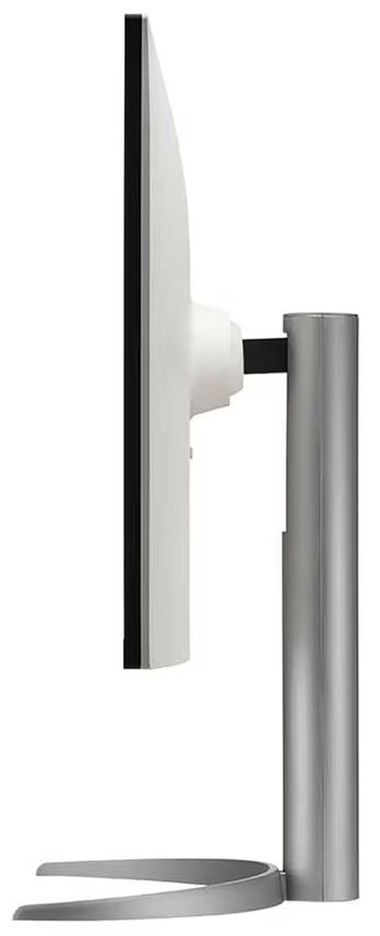 Widok z boku monitora komputera. Ma biały ekran, czarną ramkę i srebrną podstawę.