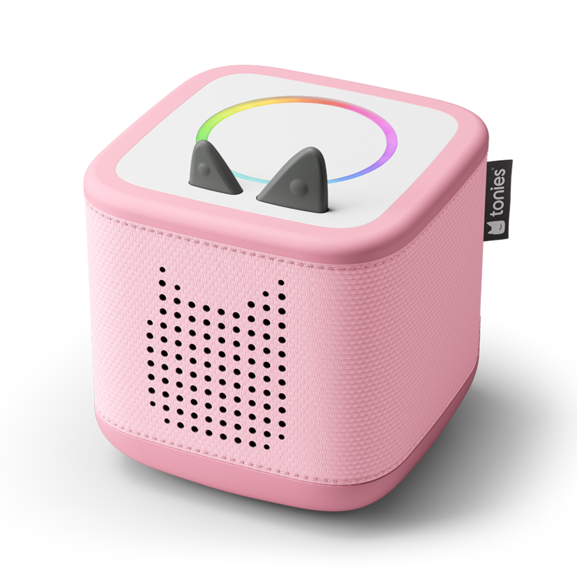Ein rosa würfelförmiger Audioplayer mit Katzenohren und einem farbenfrohen Lichtring. Es hat Lautsprecherlöcher und ein 'tonies'-Etikett.