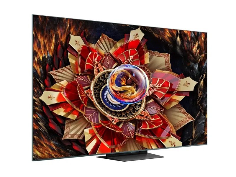 A TV képernyője egy élénk, művészi dizájnt jelenít meg, piros, arany és kék elemekkel, középen egy sárkánnyal.