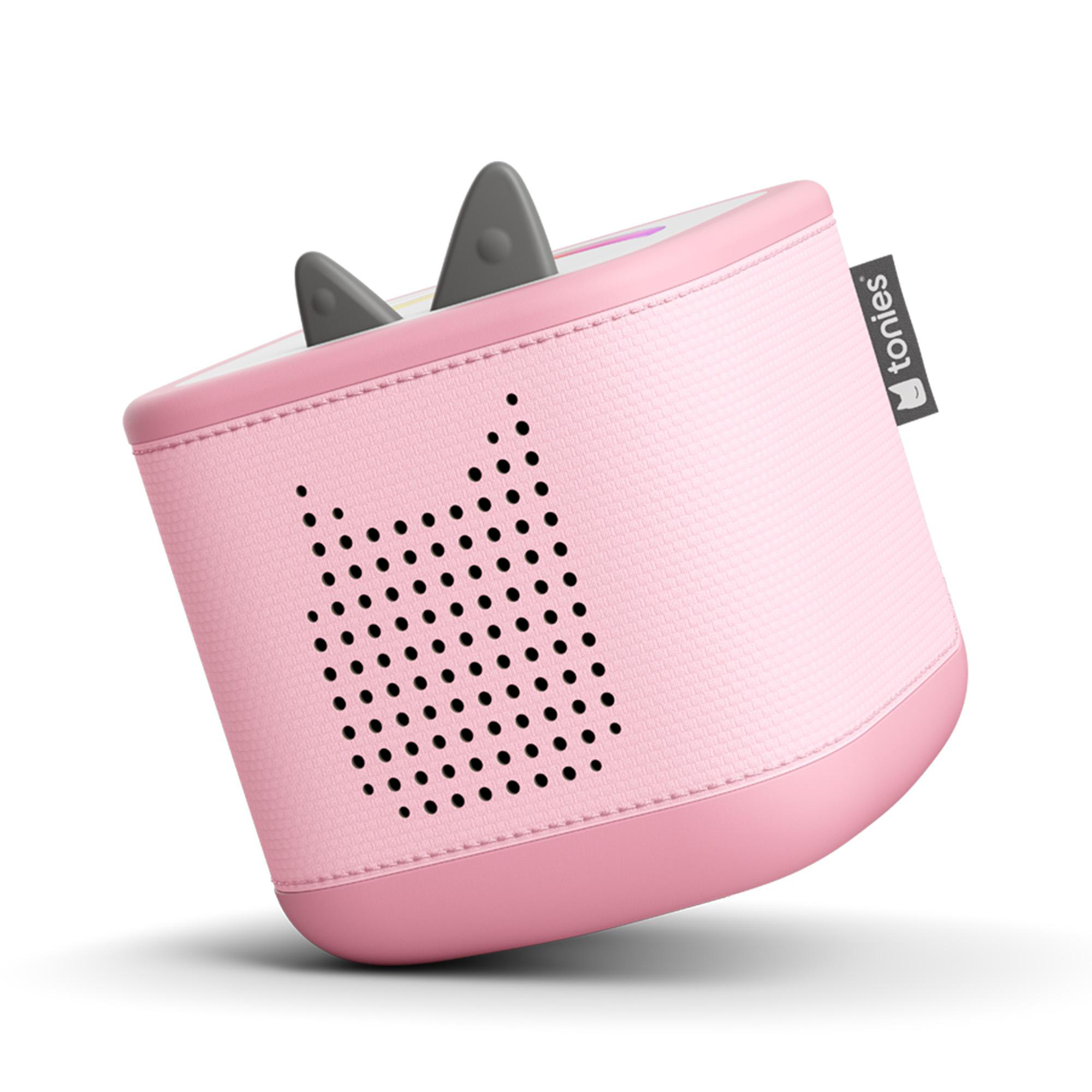Eine rosa Toniebox, ein Kinderspieler, mit grauen Ohren oben. Es hat ein Lautsprechergitter. Das Logo befindet sich an der Seite.