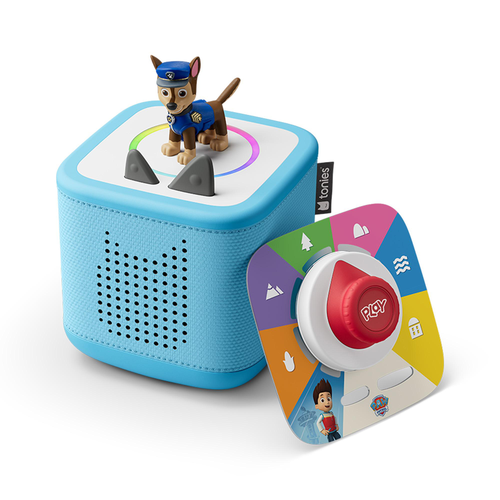 Ein blaues Spielzeug mit einer Paw Patrol-Figur oben. Eine farbcodierte Scheibe und ein roter Knopf befinden sich in der Nähe des Spielzeugs.