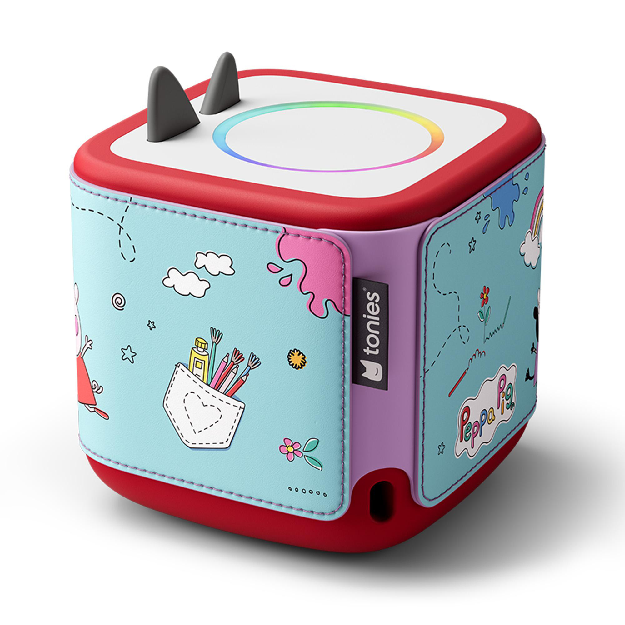 Eine rote und blaue Peppa Pig Toniebox. Sie hat einen mehrfarbigen Lichtring, zwei schwarze Ohren und Illustrationen von Peppa Pig und Kunstbedarf.