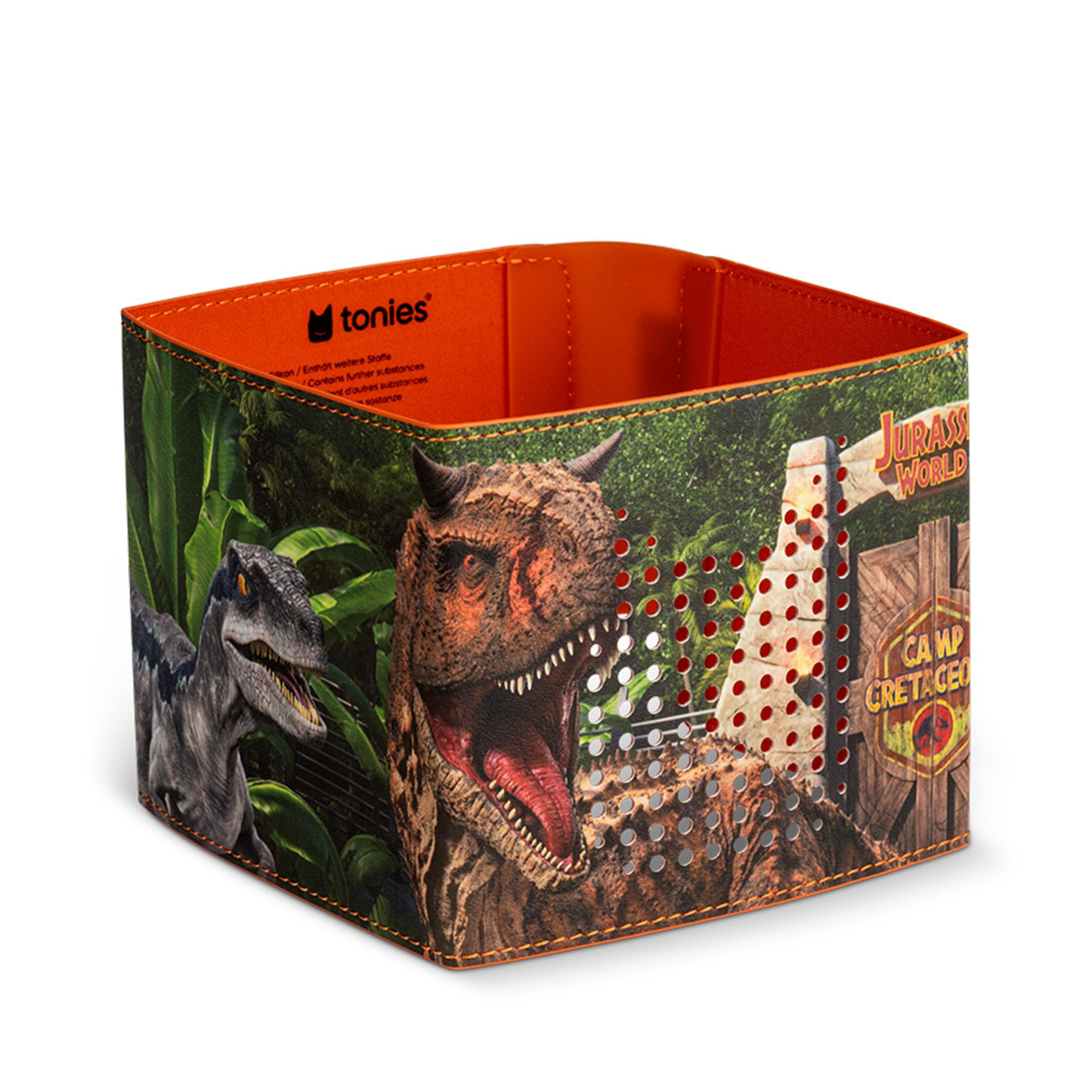 Box mit Jurassic World-Design. Mit Dinosauriern, einem Tor und den Worten "Camp Cretaceous".