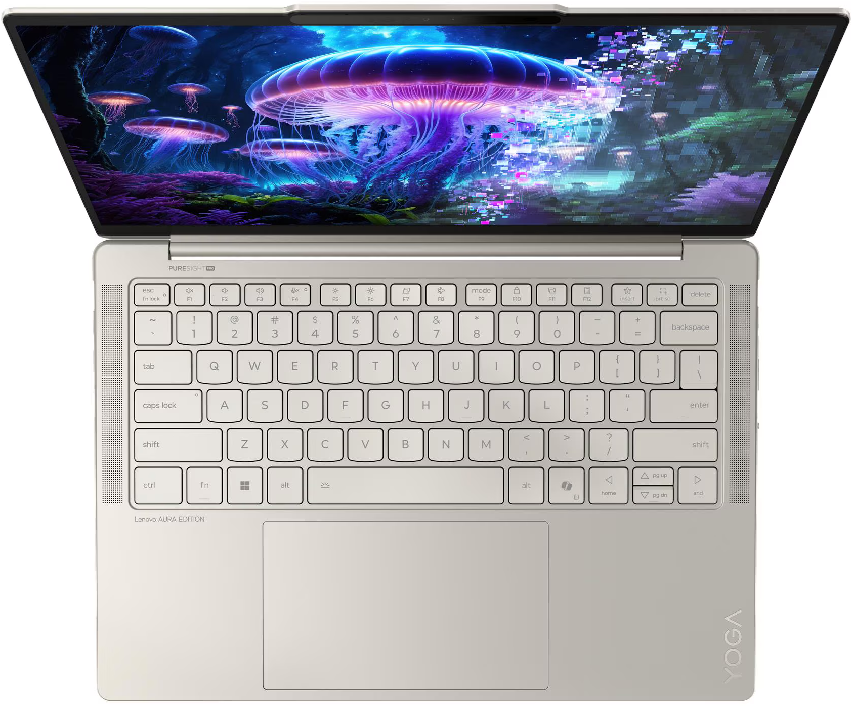 Laptop nyitott képernyővel, amely medúzákat jelenít meg egy szürreális víz alatti jelenetben. Billentyűzet látható; Lenovo Aura Edition.