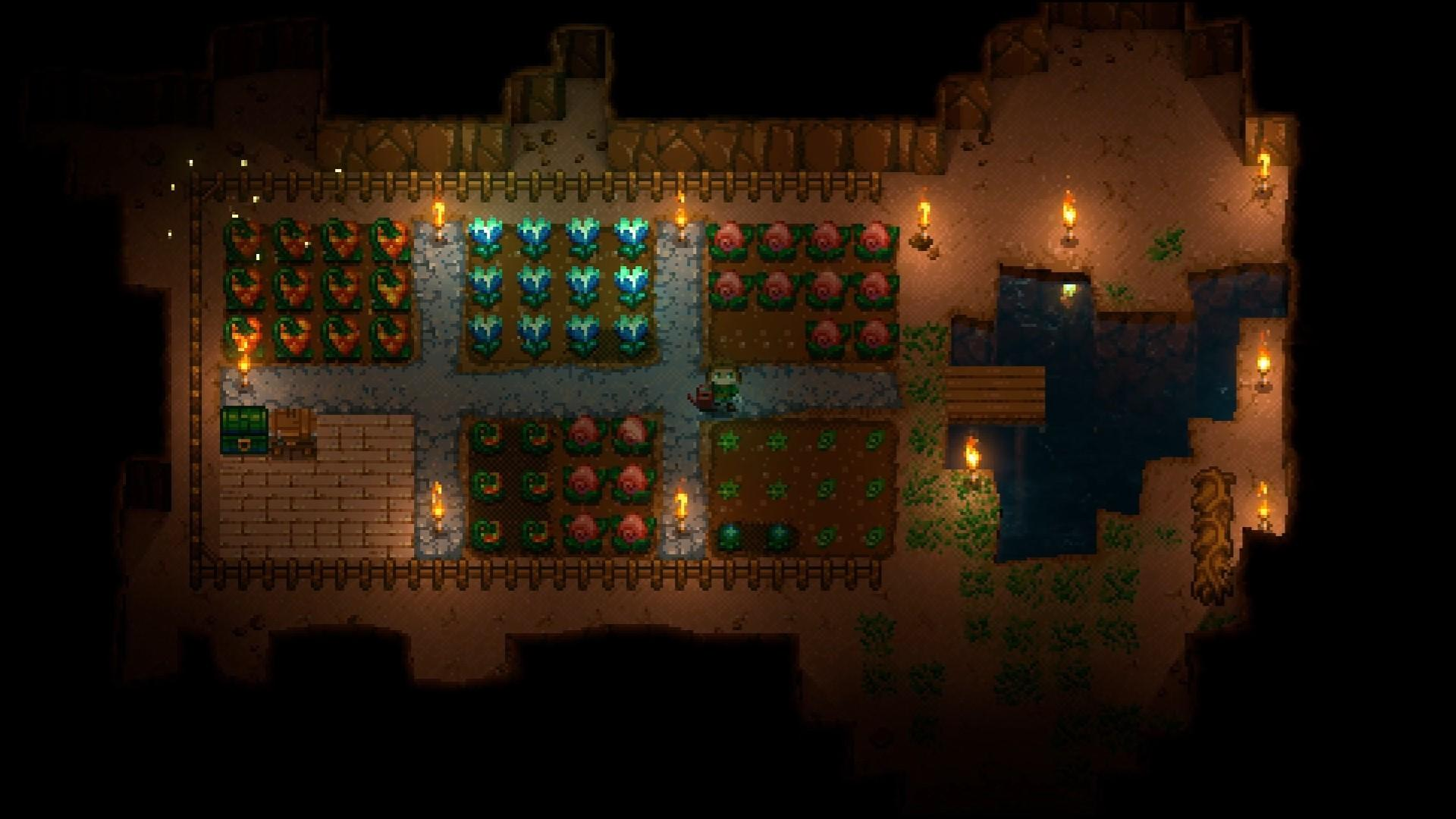 Eine Draufsicht auf eine pixelige Untergrundfarm. Verschiedene Feldfrüchte sind in Parzellen gepflanzt. Fackeln beleuchten die Szene.
