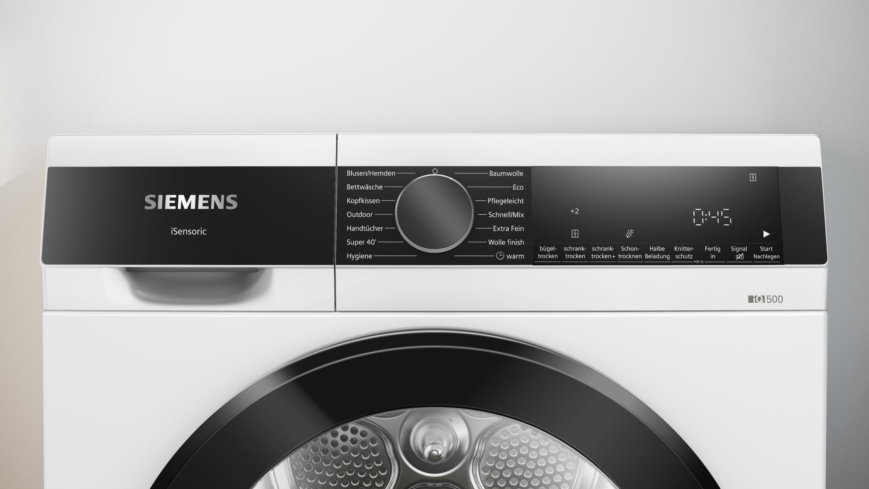 Ein weißer Siemens-Trockner mit schwarzem Bedienfeld. Er hat eine Digitalanzeige mit Uhrzeit und verschiedenen Trocknungsoptionen.