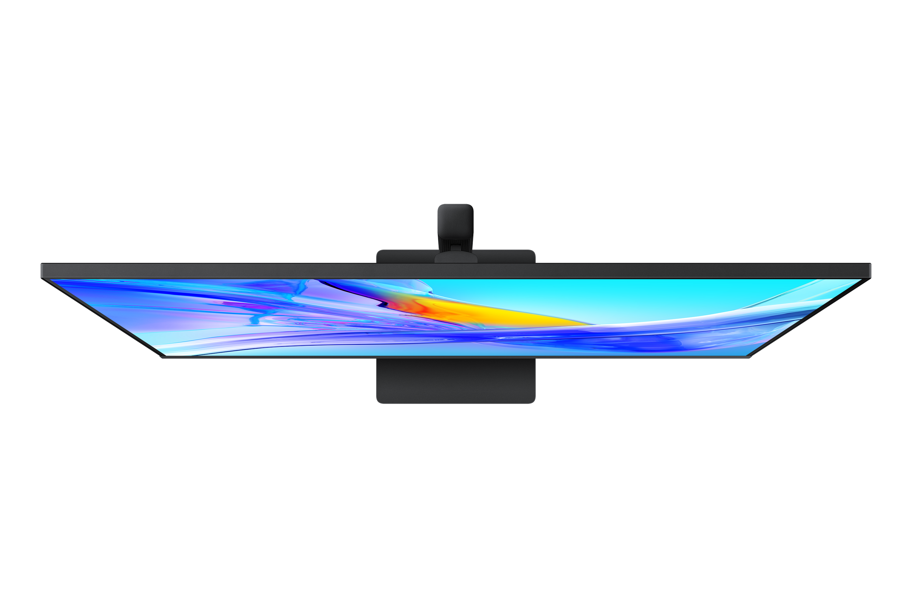 Draufsicht auf einen schwarzen Monitor mit farbenfrohem, abstraktem Design auf schwarzem Hintergrund.