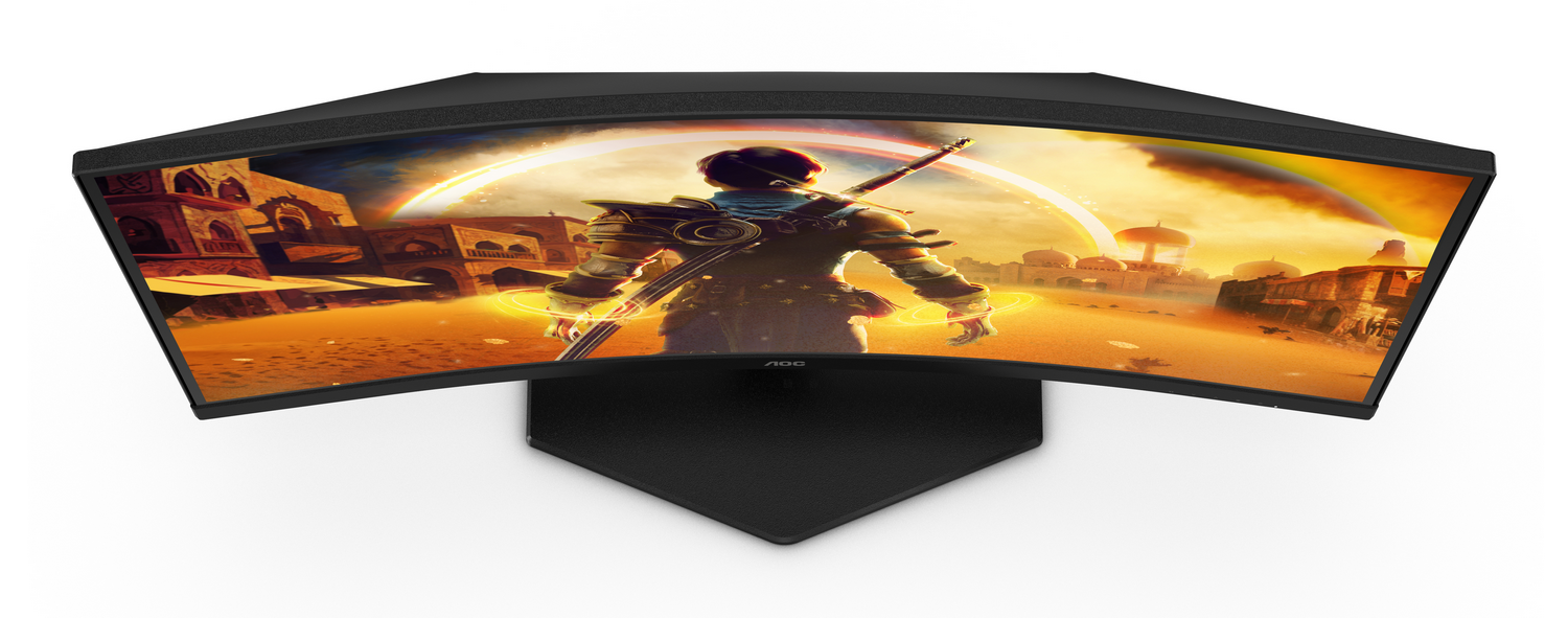 Monitor curvo que muestra una escena desértica con un personaje sosteniendo una espada. El monitor es negro con base blanca.