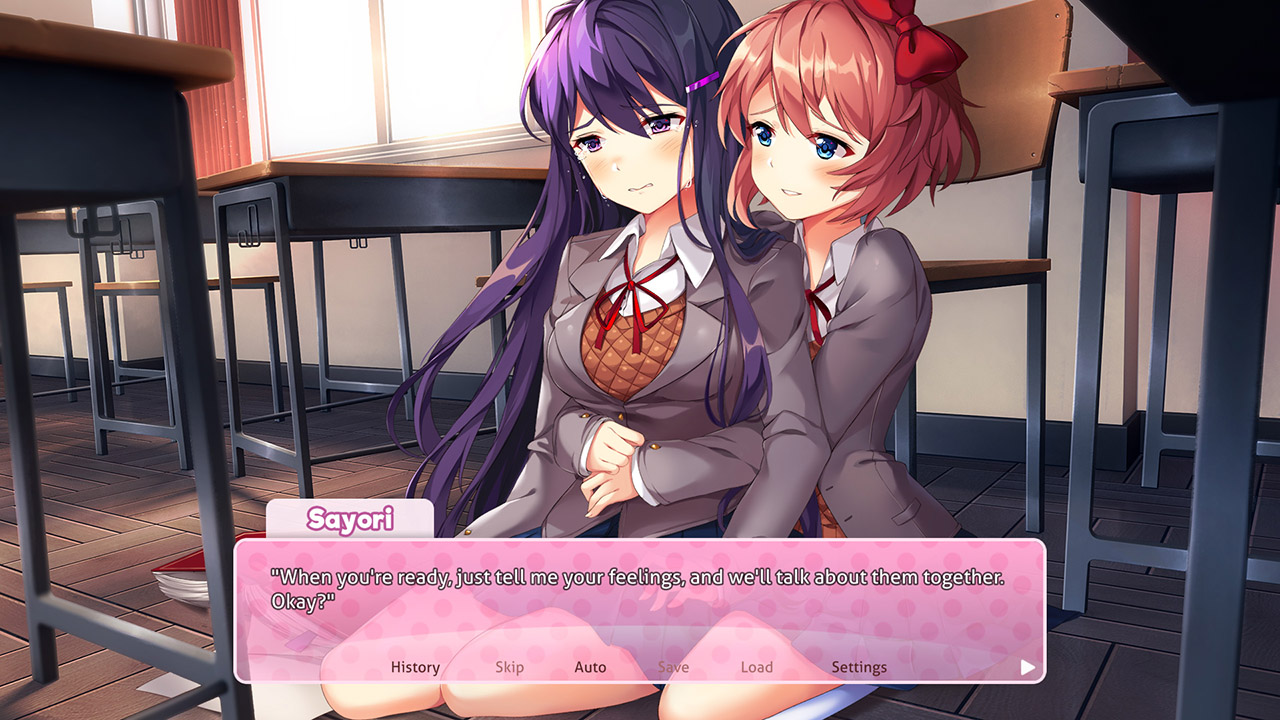 Zwei Anime-Schülerinnen trösten sich in einem Klassenzimmer. Eine mit lila Haaren weint. Eine Dialogbox zeigt Text an.