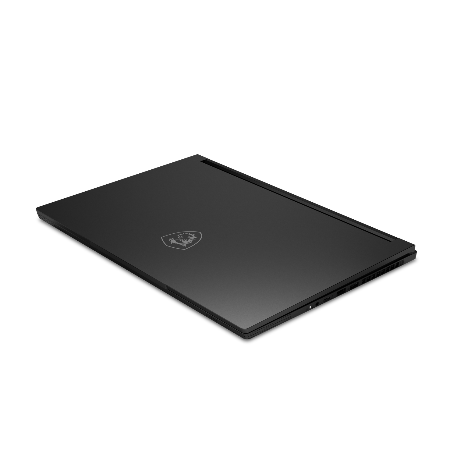 Un ordinateur portable noir posé sur une surface noire. L'ordinateur est fermé, avec un logo sur le dessus. Le fond est noir.