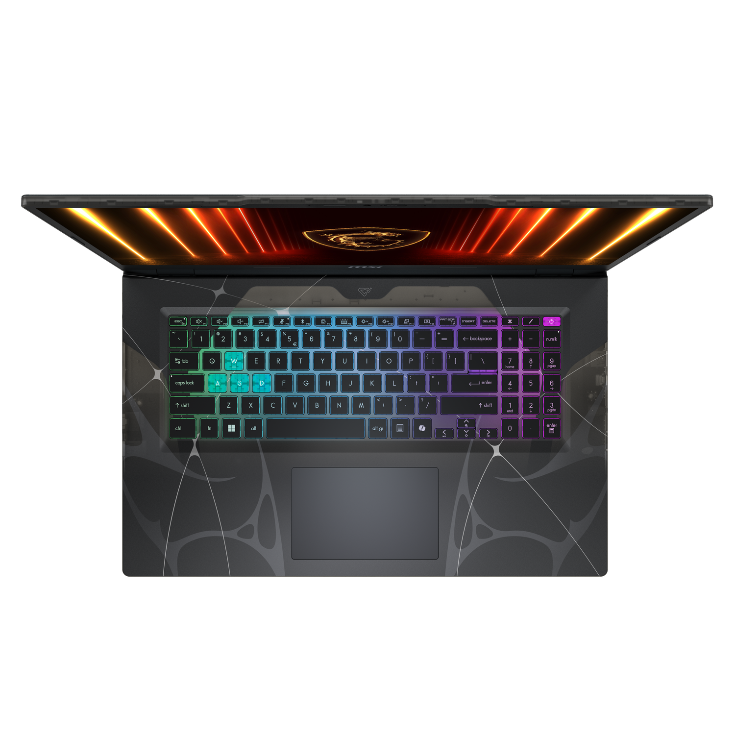 Vue de dessus d'un ordinateur portable. Le clavier s'illumine de couleurs arc-en-ciel. L'écran est ouvert, affichant un dégradé orange et rouge.