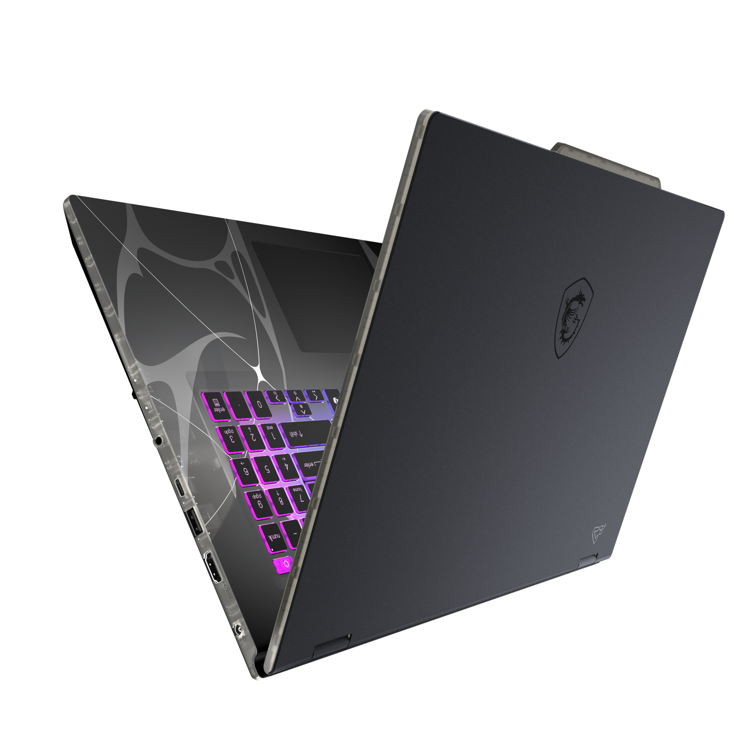 Ordinateur portable noir ouvert avec clavier éclairé, montrant un logo de dragon. L'écran a un design, sur fond noir.