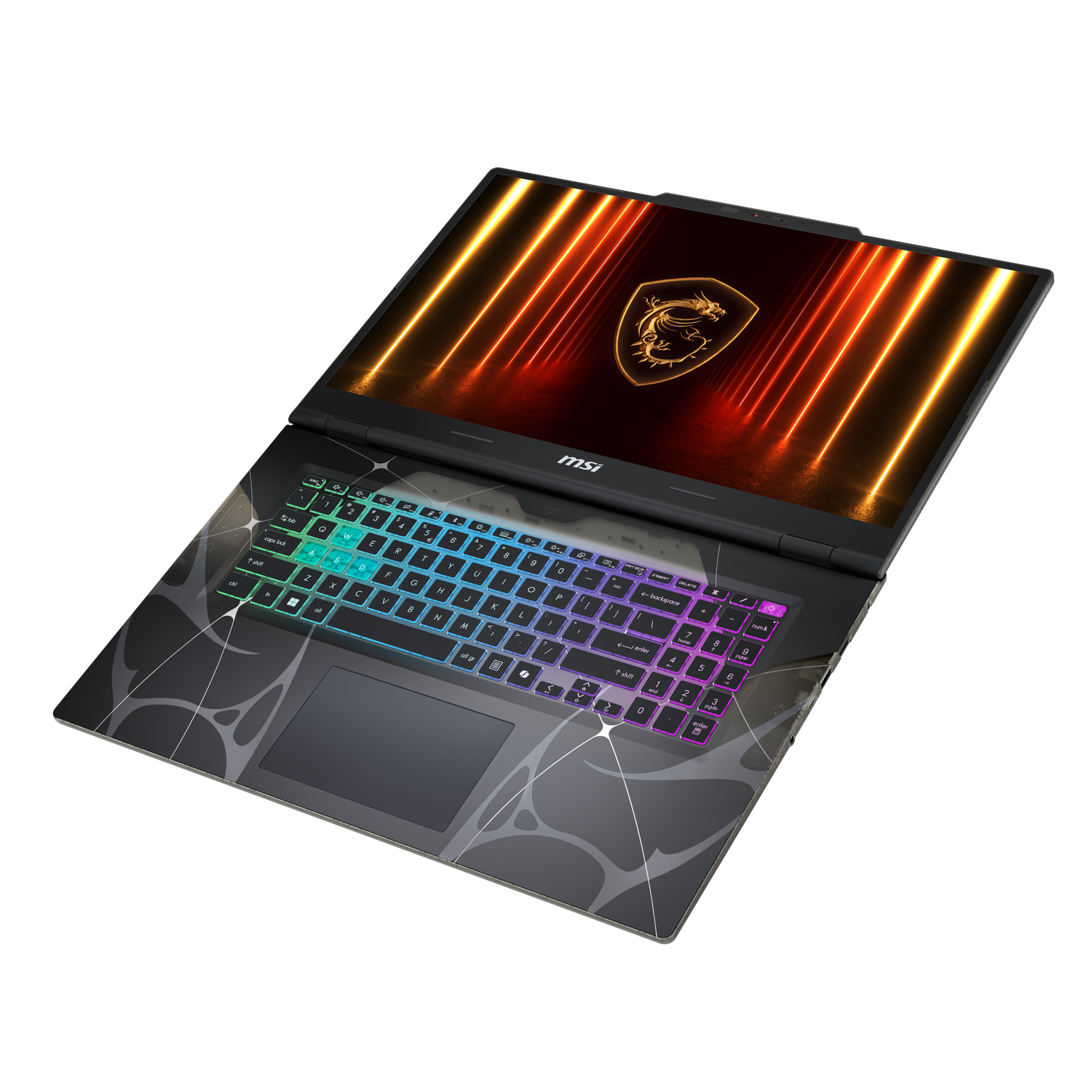 Un ordinateur portable de jeu est ouvert, affichant un logo de dragon sur l'écran. Le clavier est illuminé de couleurs arc-en-ciel. Le fond est noir.