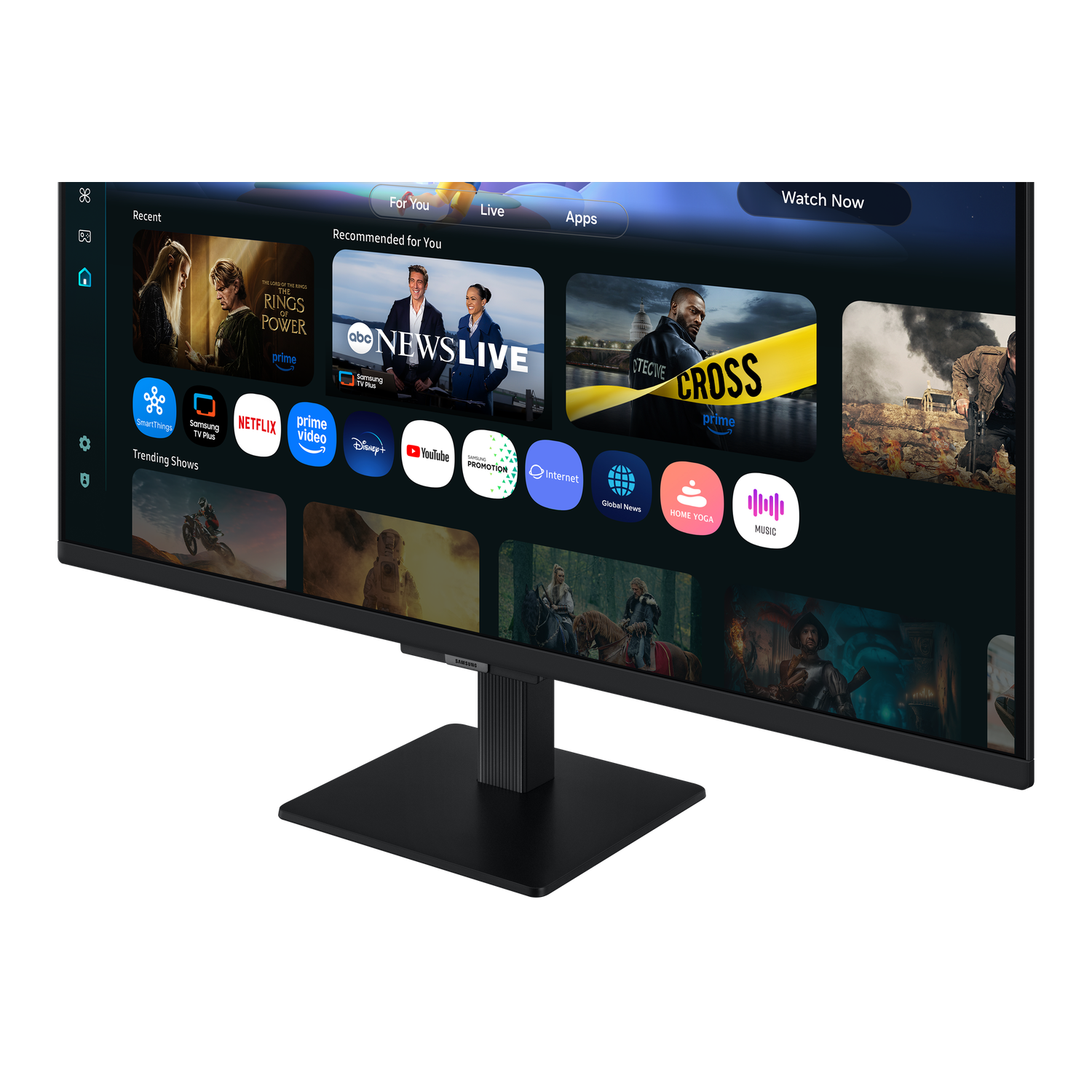 A black monitor displays a TV interface with app icons and show recommendations. The screen shows a selection of apps and shows.