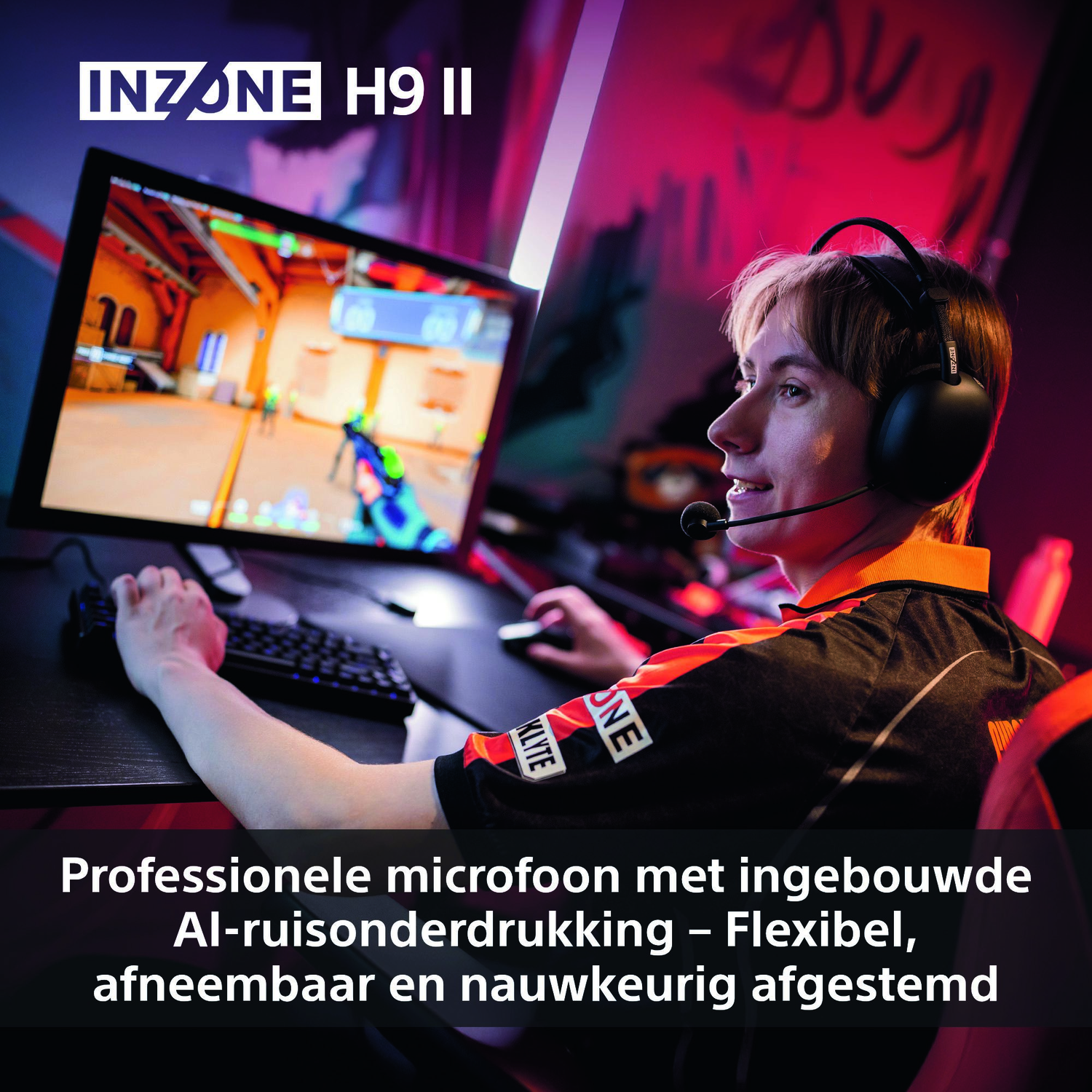 A person wearing a headset looks at a computer screen playing a game. The person has a microphone and is wearing a black and orange shirt.