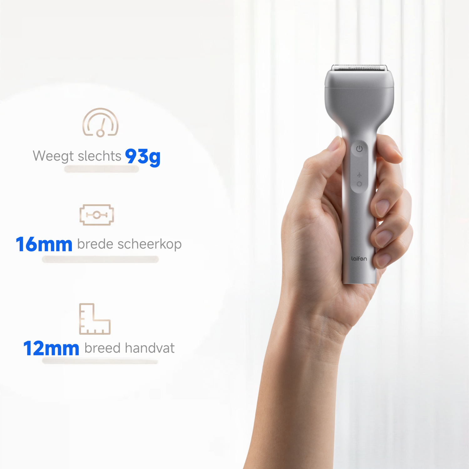 A silver electric shaver is held by a hand. Text indicates its weight, head width, and handle width. Background is a white curtain.