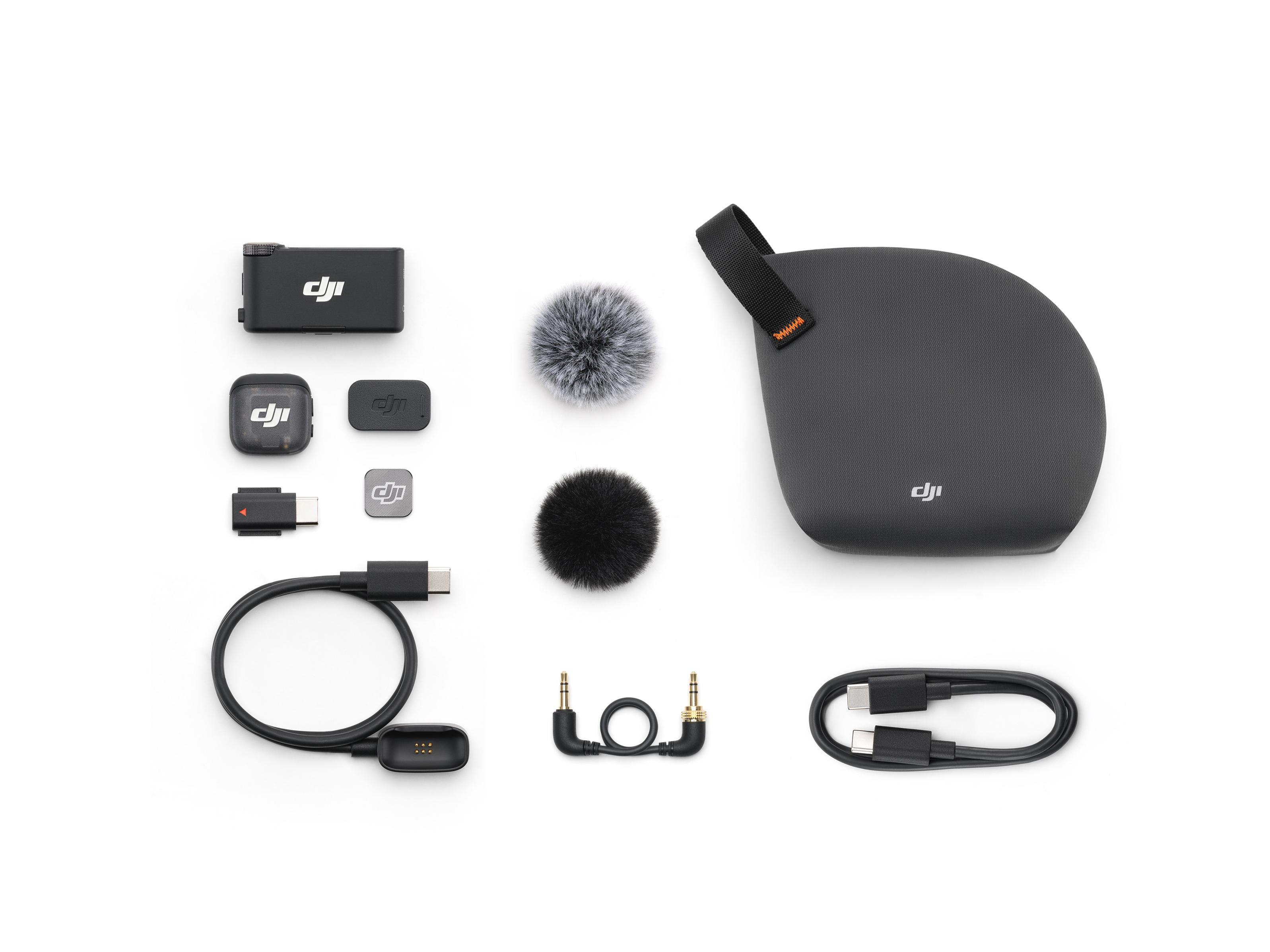 DJI drahtloses Mikrofon-Kit auf weißem Hintergrund. Enthält Mikrofon, Hülle, Kabel, Fellwindschutz und Anschlüsse.