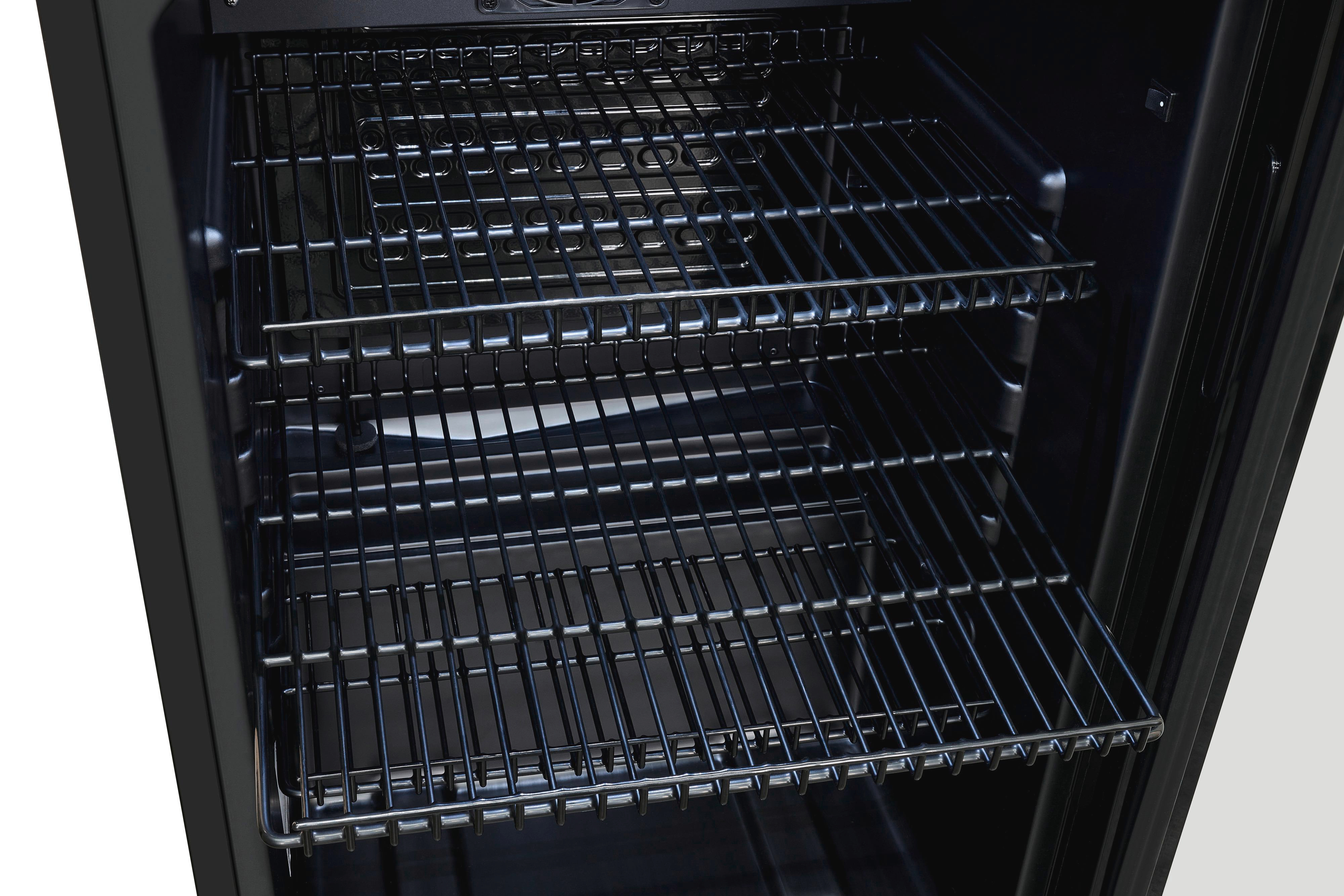 Im Inneren eines schwarzen Geräts sind drei Metallgitter zu sehen. Der Innenraum ist schwarz, der Hintergrund weiß.