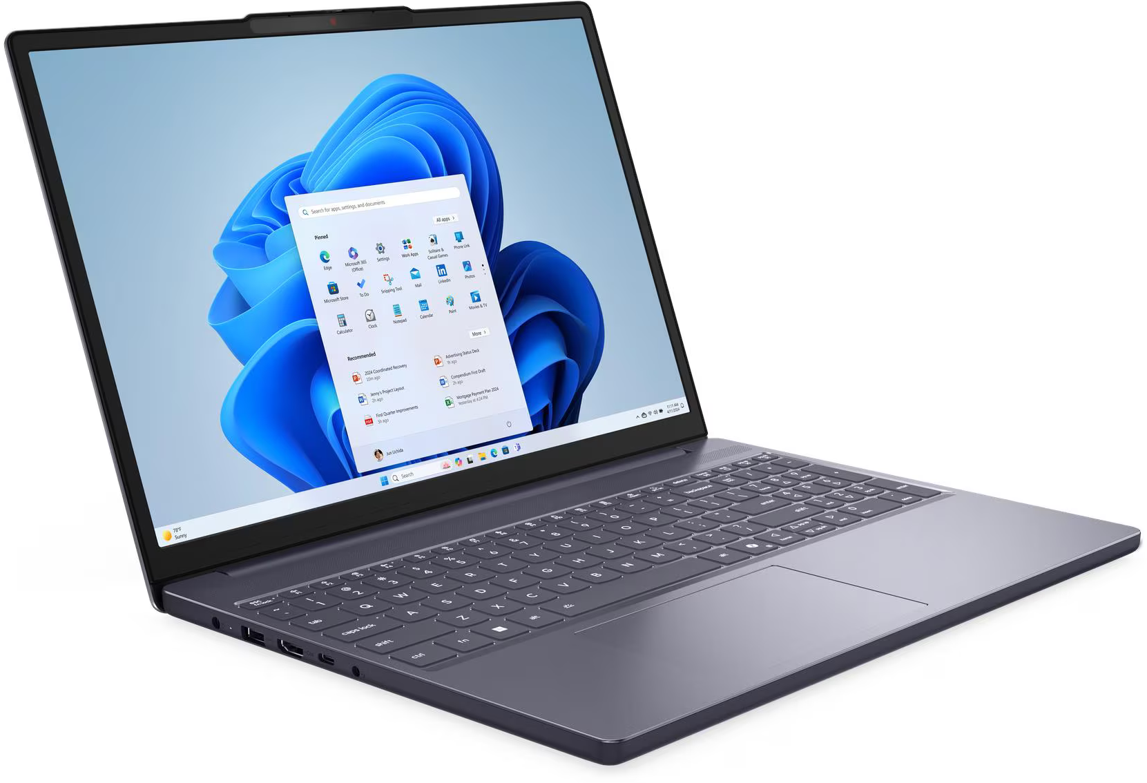 Laptop Windows 11 felülettel. A képernyő egy nyitott start menüt mutat alkalmazásikonokkal. Billentyűzet és touchpad látható.
