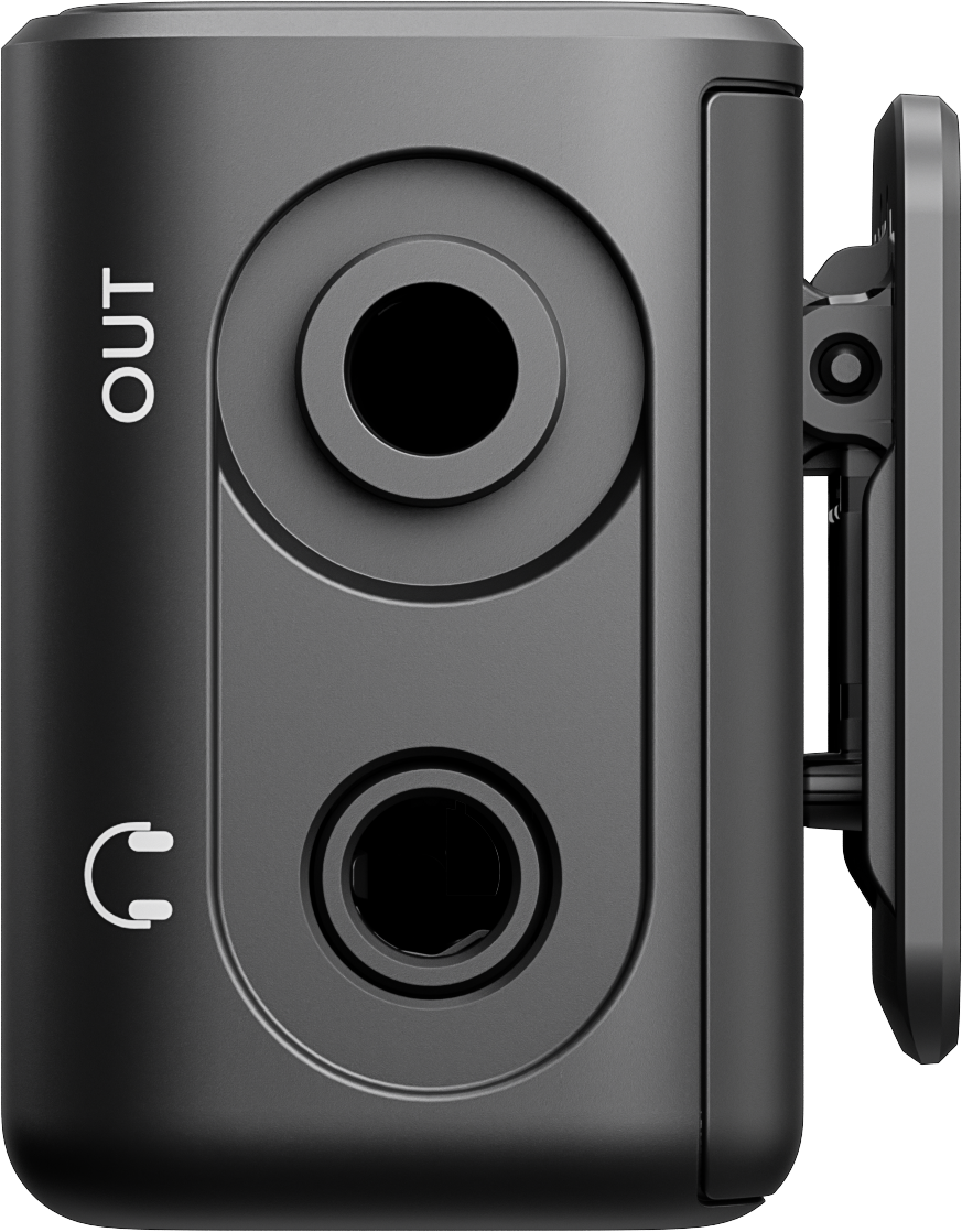 Un appareil audio noir avec deux ports circulaires et un symbole de casque. Il a un clip sur le côté, avec 'OUT' écrit dessus.