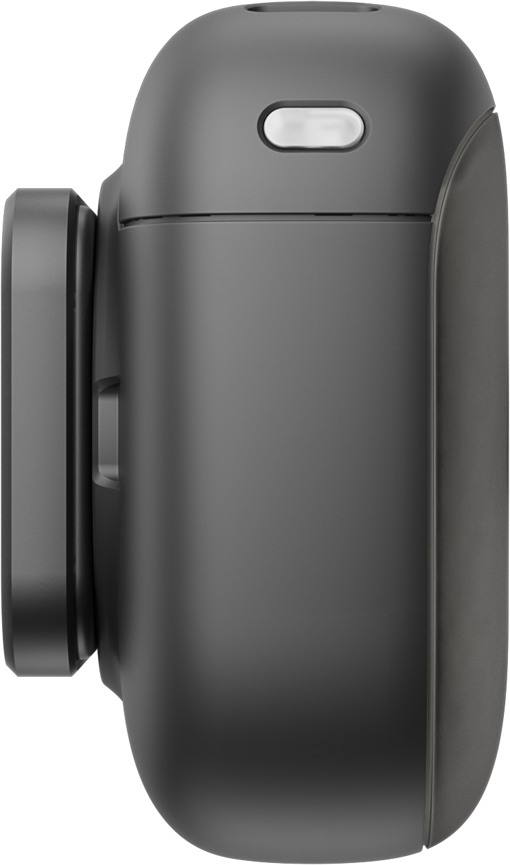 Vue latérale rapprochée d'un appareil électronique gris foncé arrondi, avec objectif et petit bouton.