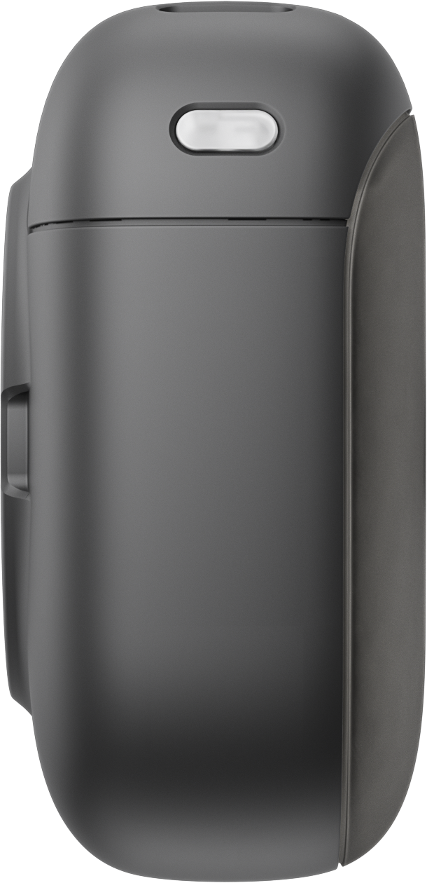 Un appareil rectangulaire arrondi gris foncé, peut-être un étui de chargement. Il a un petit ovale éclairé en haut.