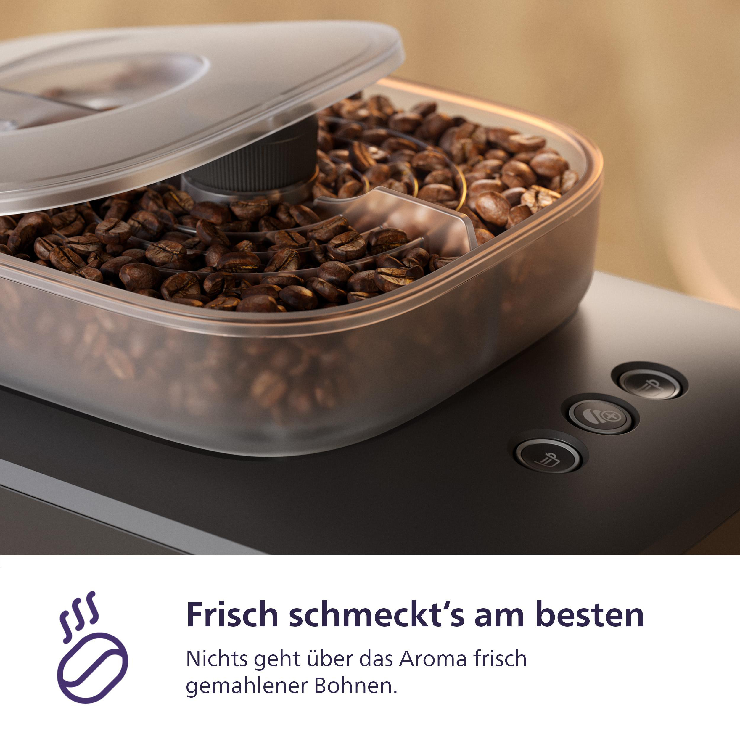 Kaffeebohnen in einem transparenten Behälter auf einer schwarzen Maschine. Der Deckel ist offen. Text darunter lautet "Frisch schmeckt's am besten".